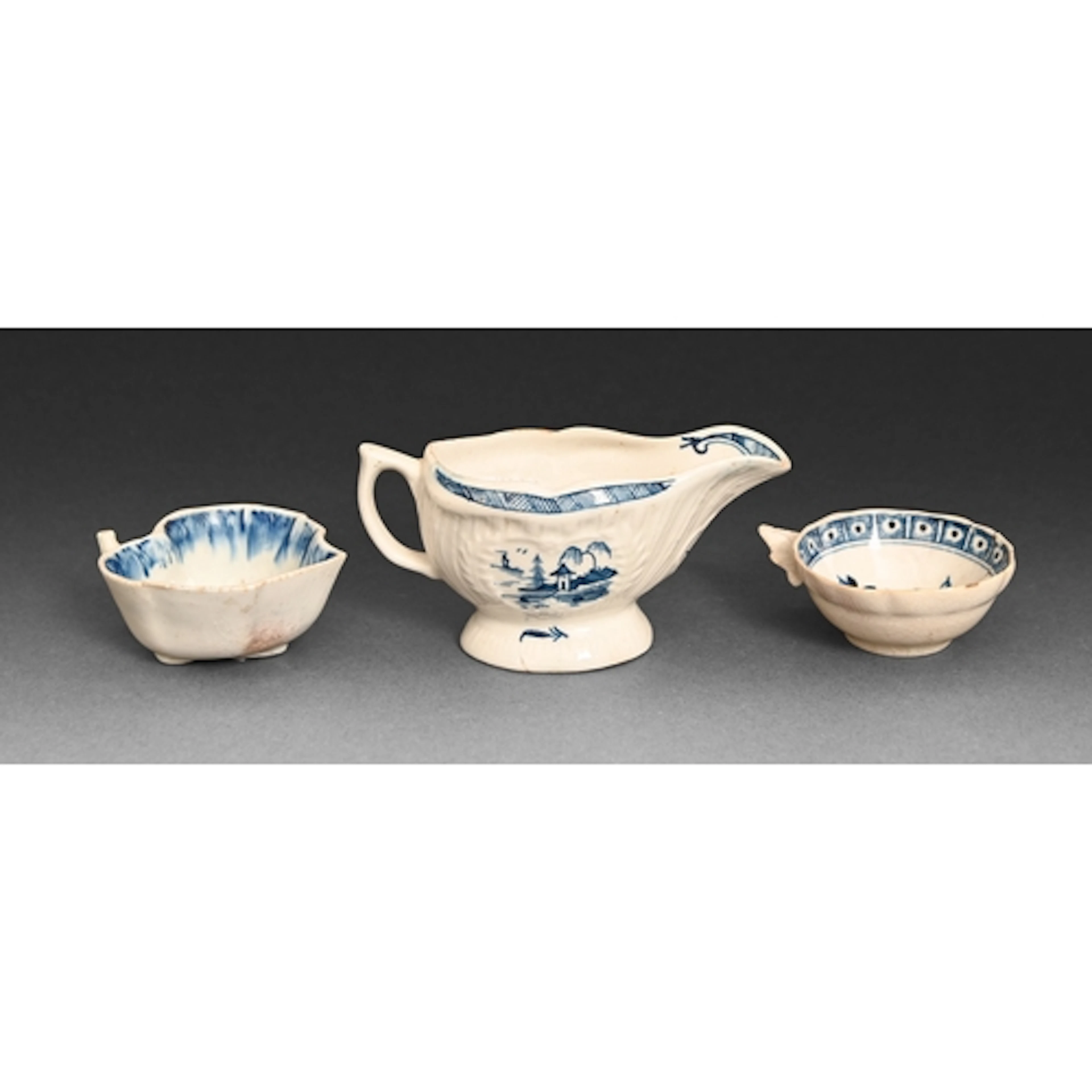 A Derby blue and white sauceboat, c1770, painted with Chines...
