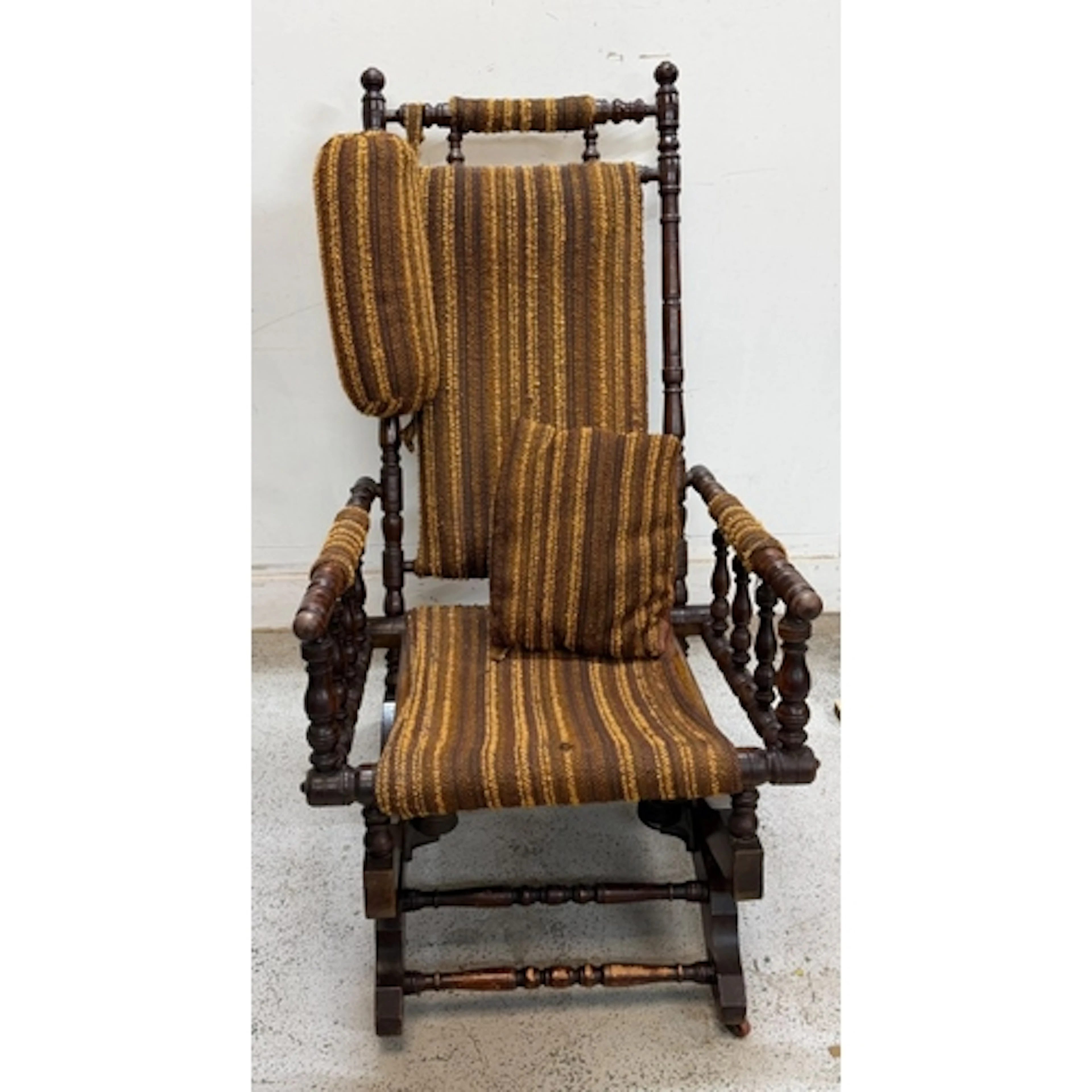 Mid Century rocker with a wooden turned frame