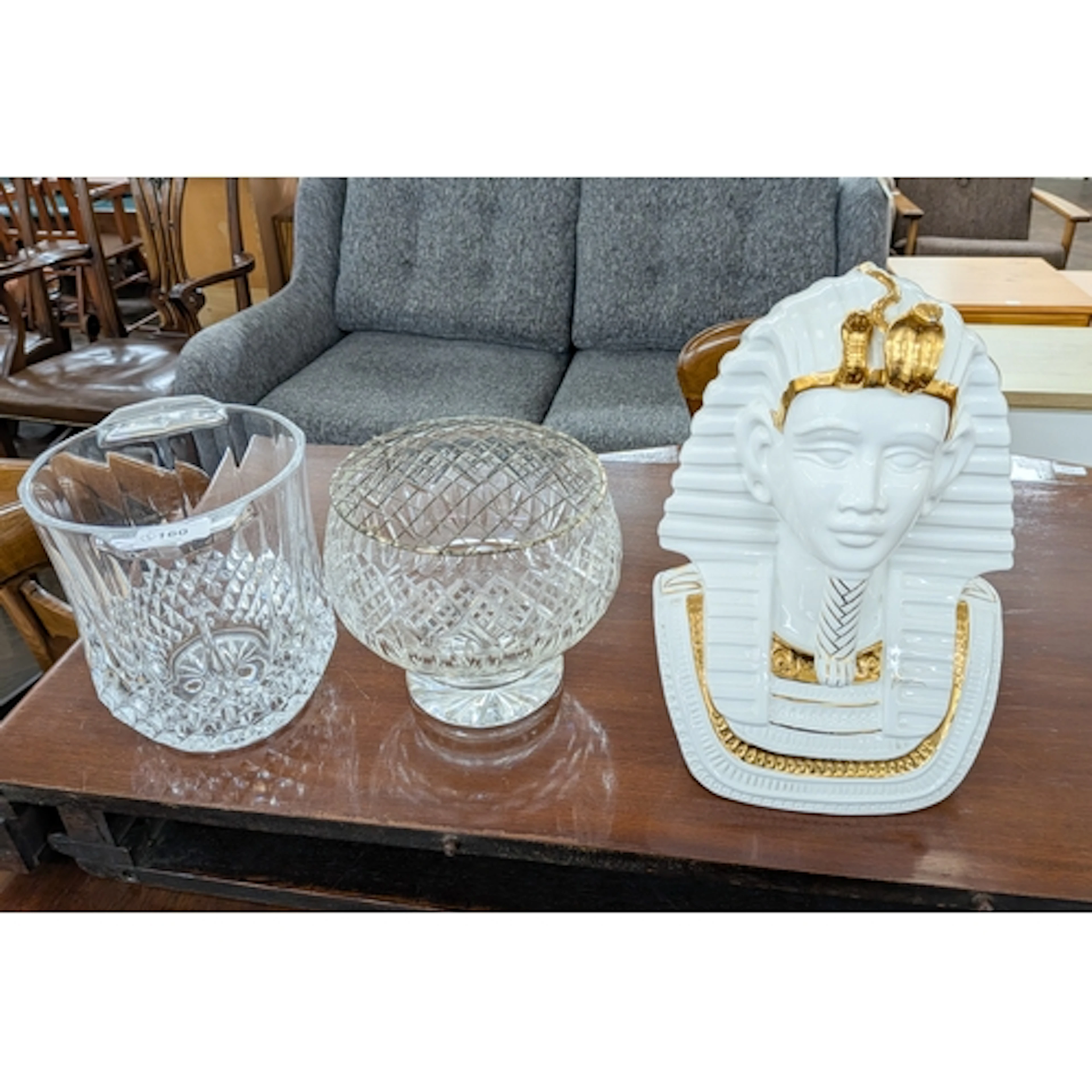A heavy glass ice bucket together with a cut glass rose bowl...