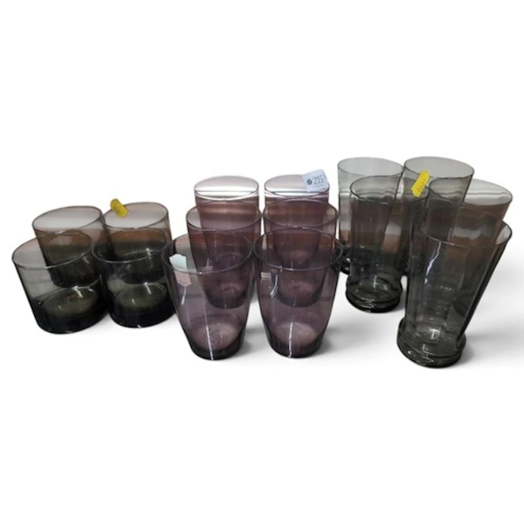 A collection of coloured glasses inc. beakers and tumblers.