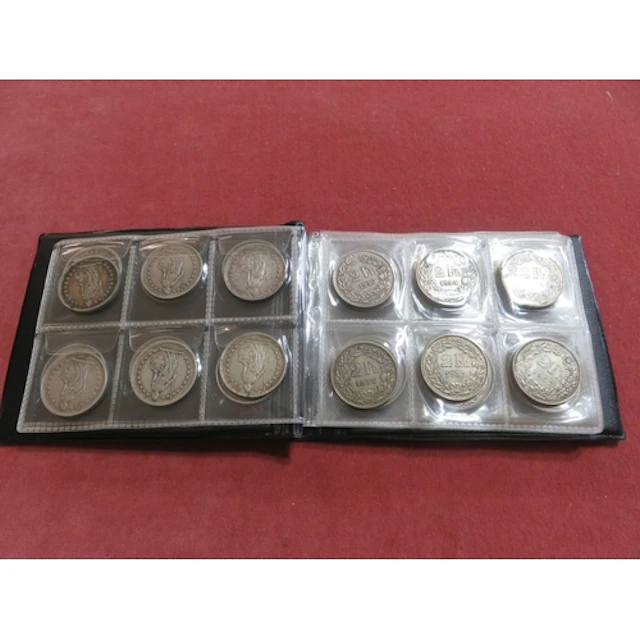 Small black album, containing various French coinage