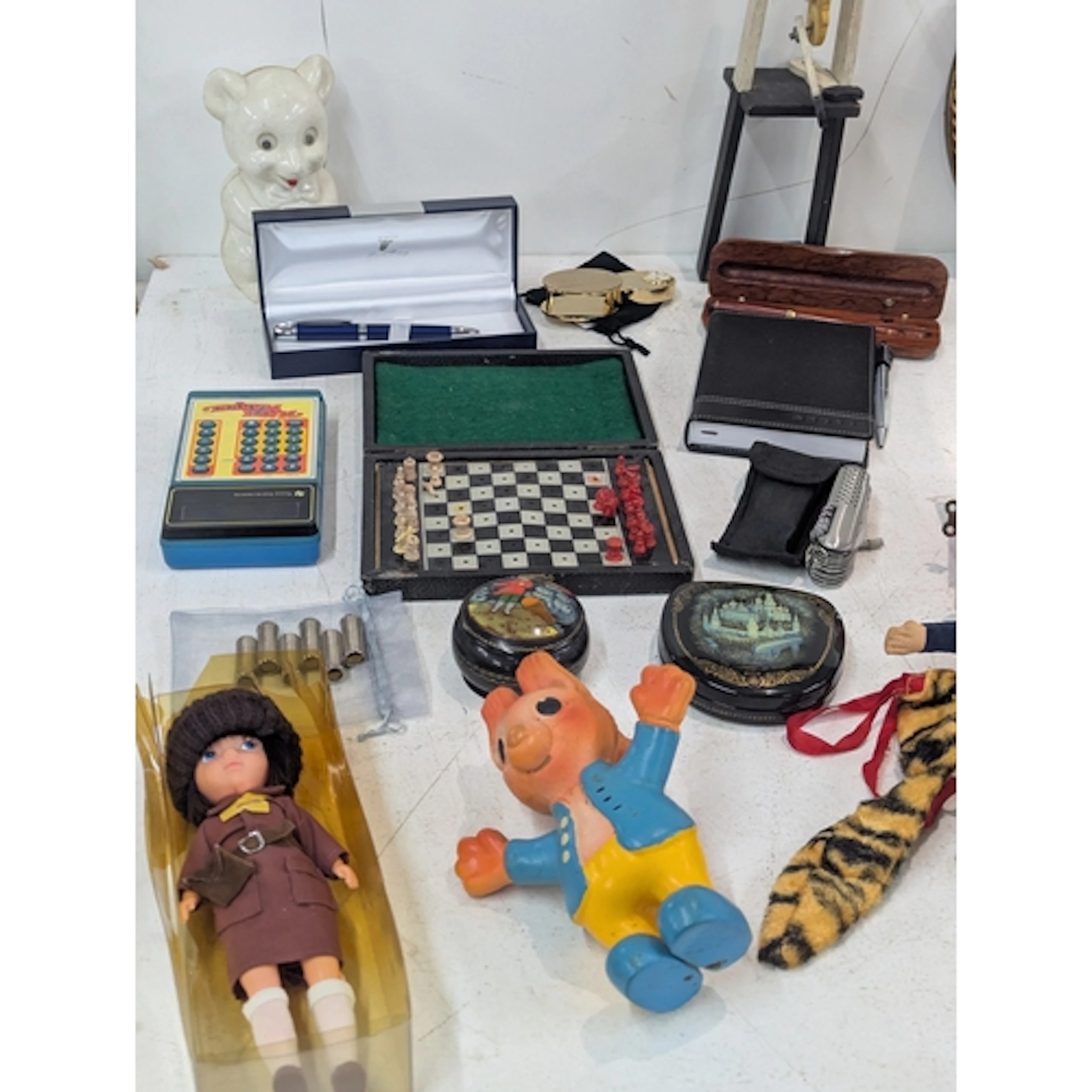 A mixed lot to include a vintage travel chess set, pens, vin...