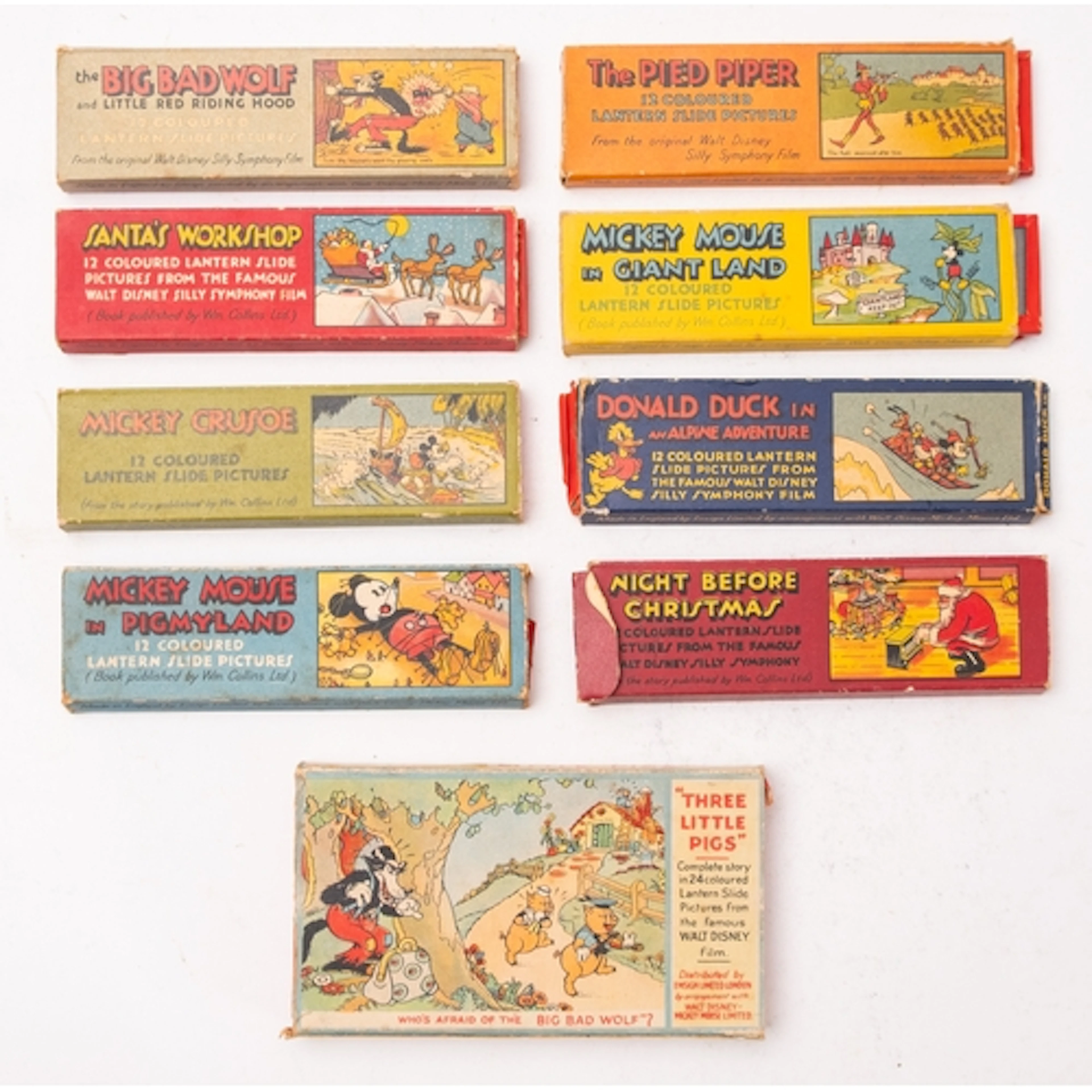 A group of nine Walt Disney magic lantern lithograph printed...