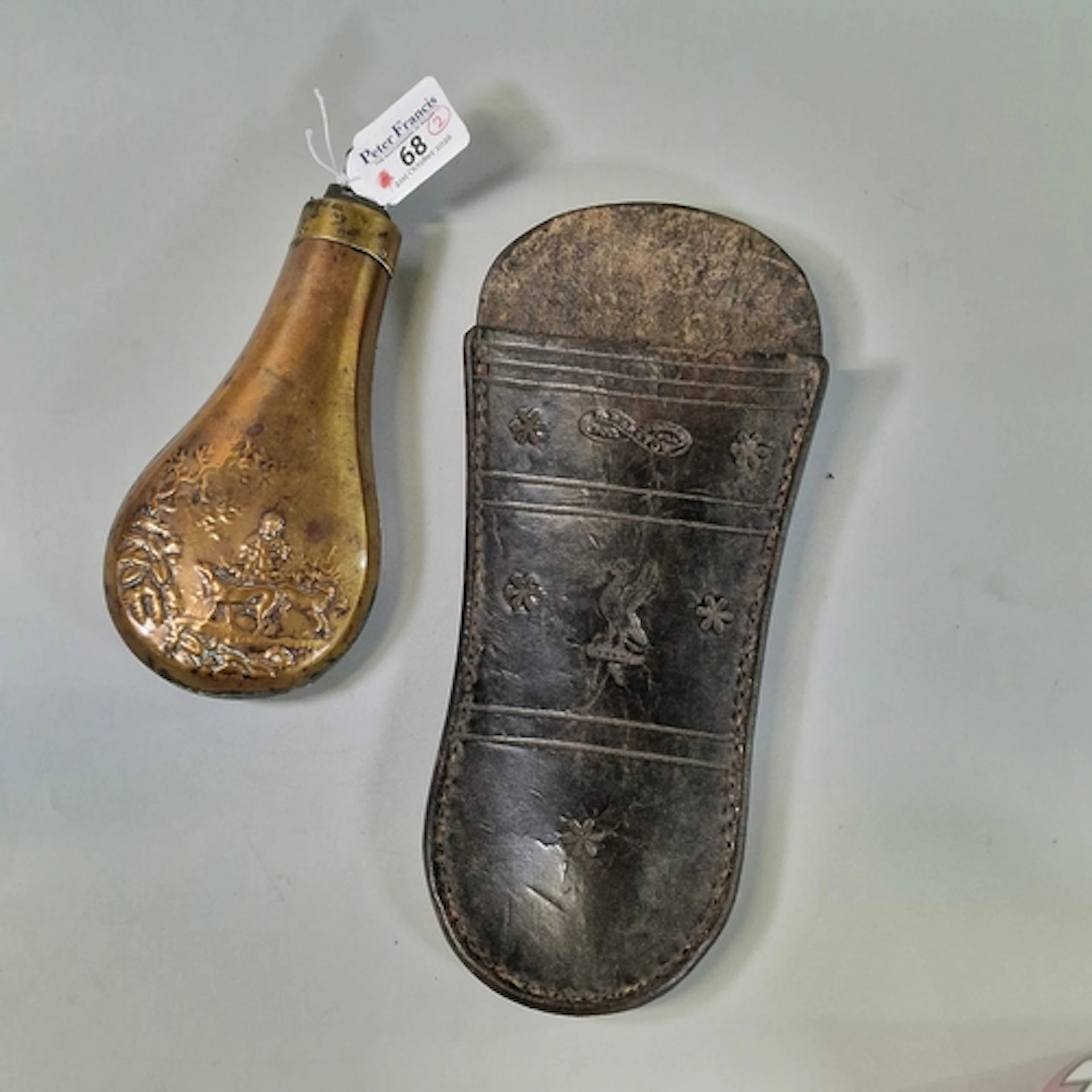 Copper and brass Hunting Powder Flask embossed with a huntin...
