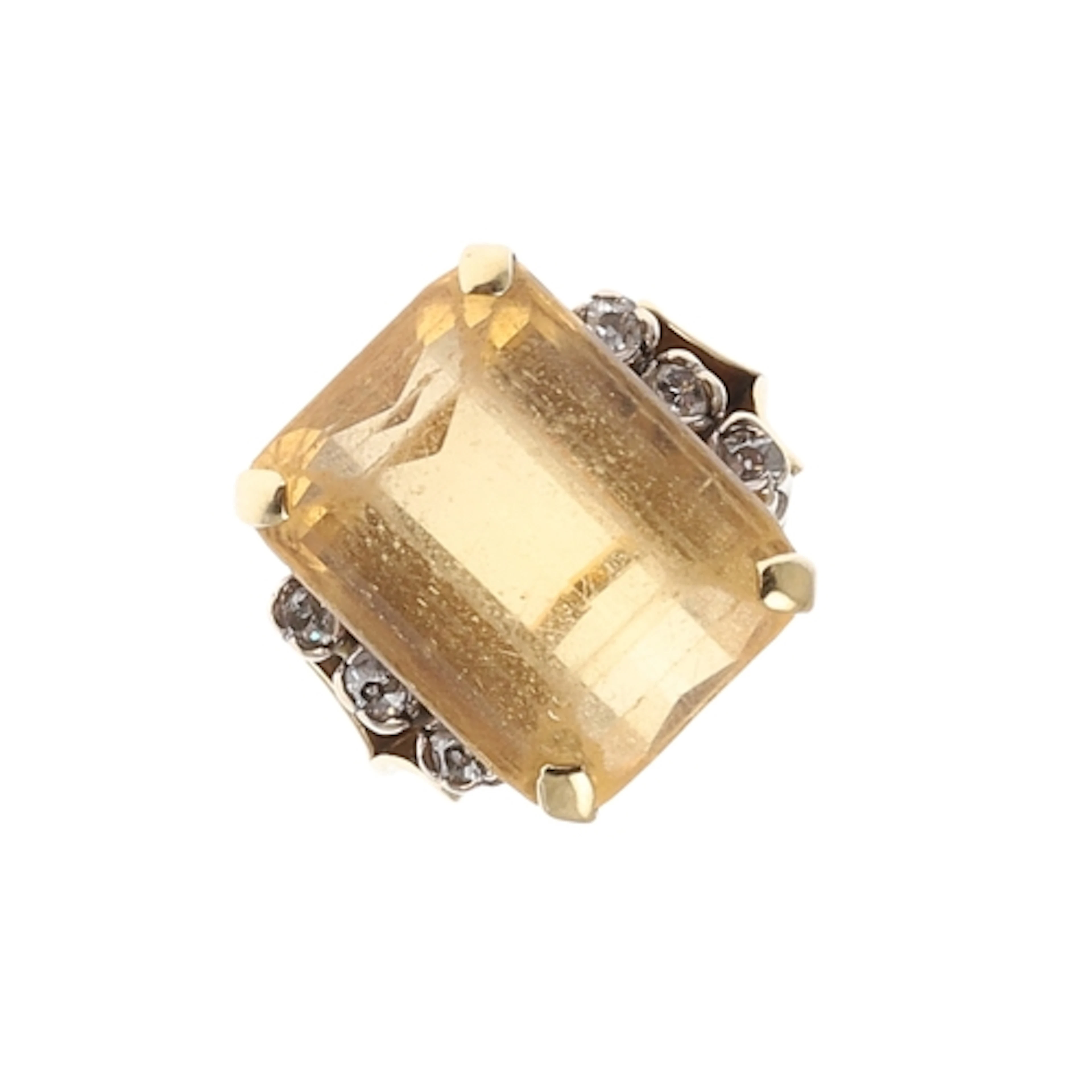 A CITRINE AND DIAMOND DRESS RING. the step-cut citrine is se...