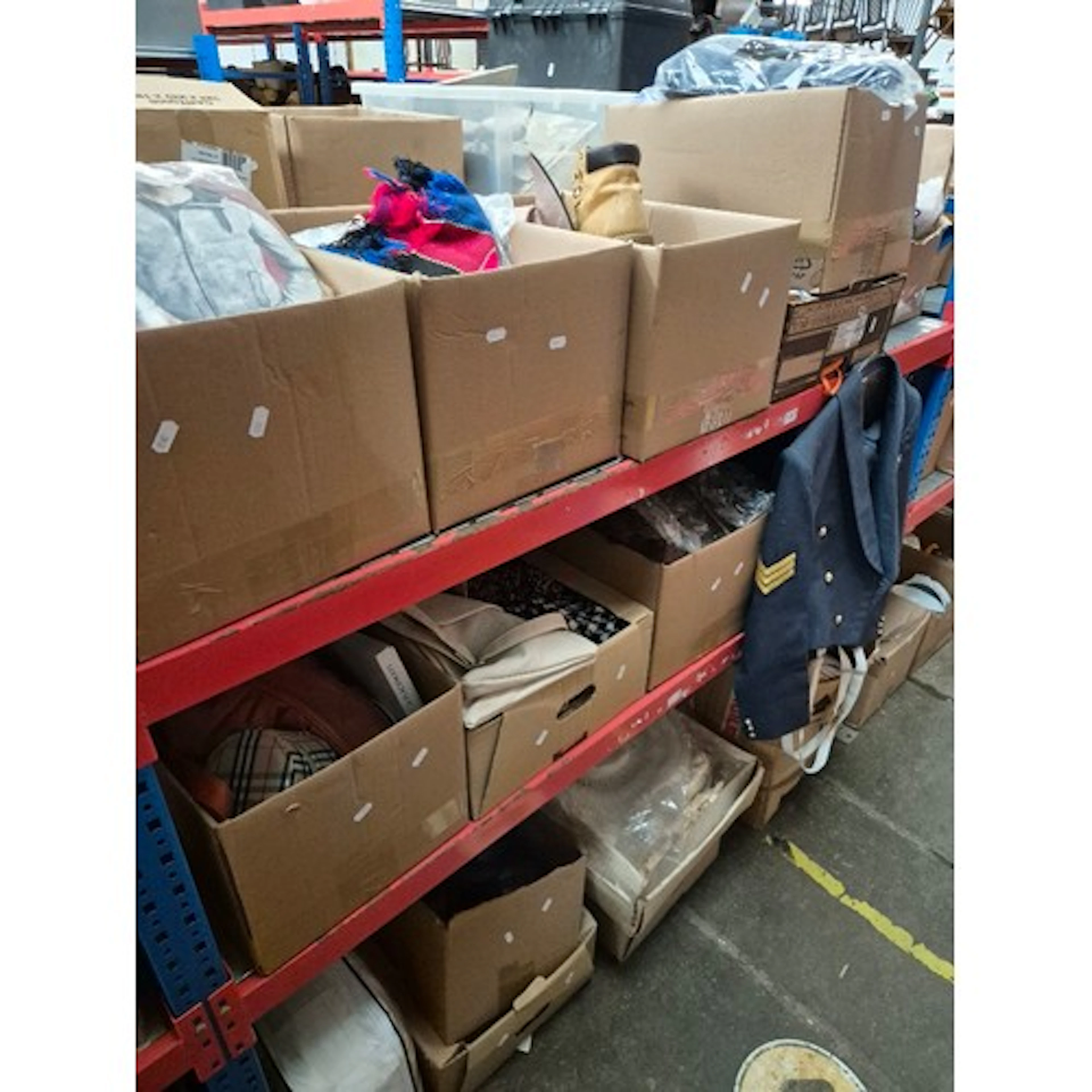 14 boxes (3 shelves) of mixed items including shirts, sports...