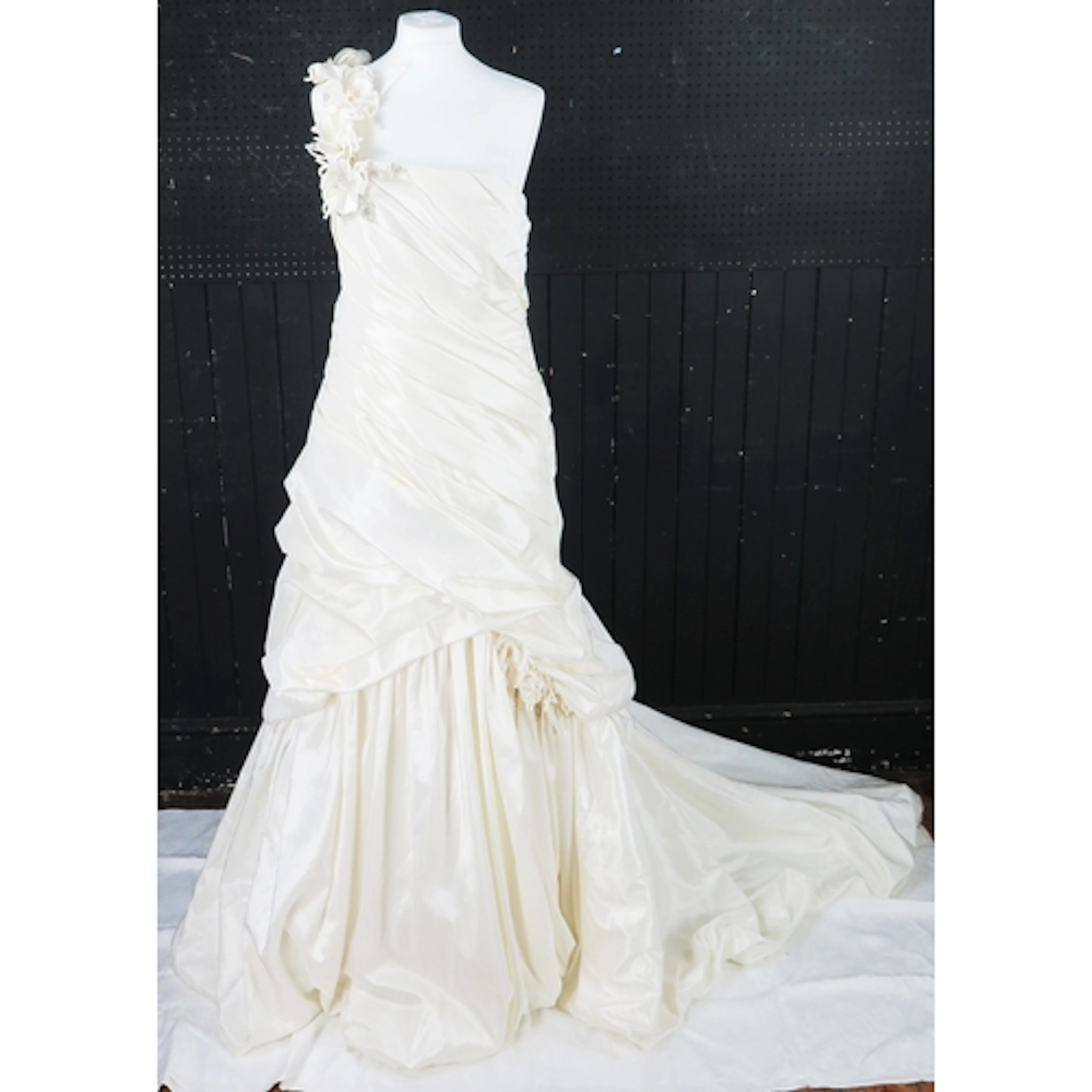 Ivory strapless bridal gown with sweetheart neckline, ruched...