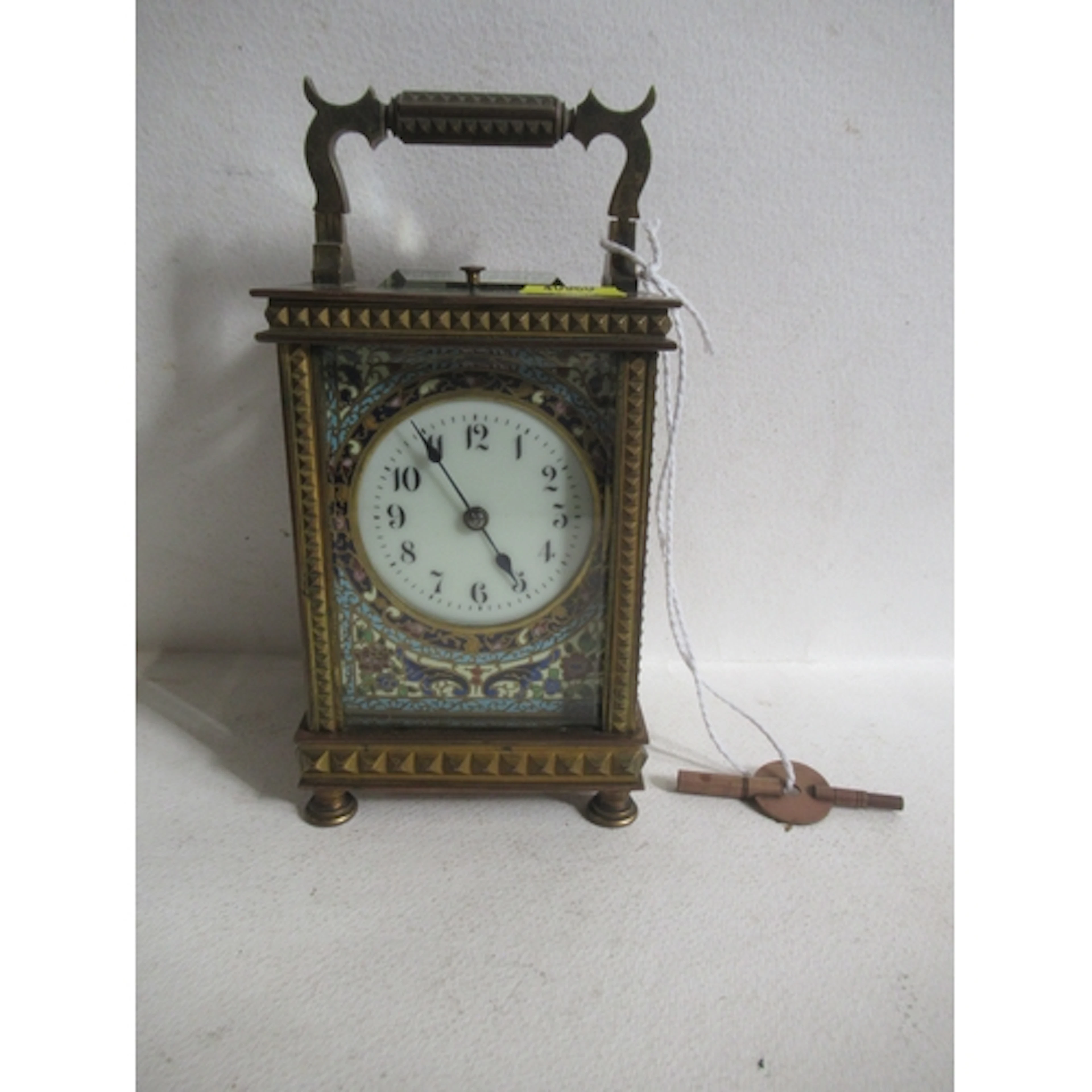 A brass cased repeating carriage clock, the white enamel dia...