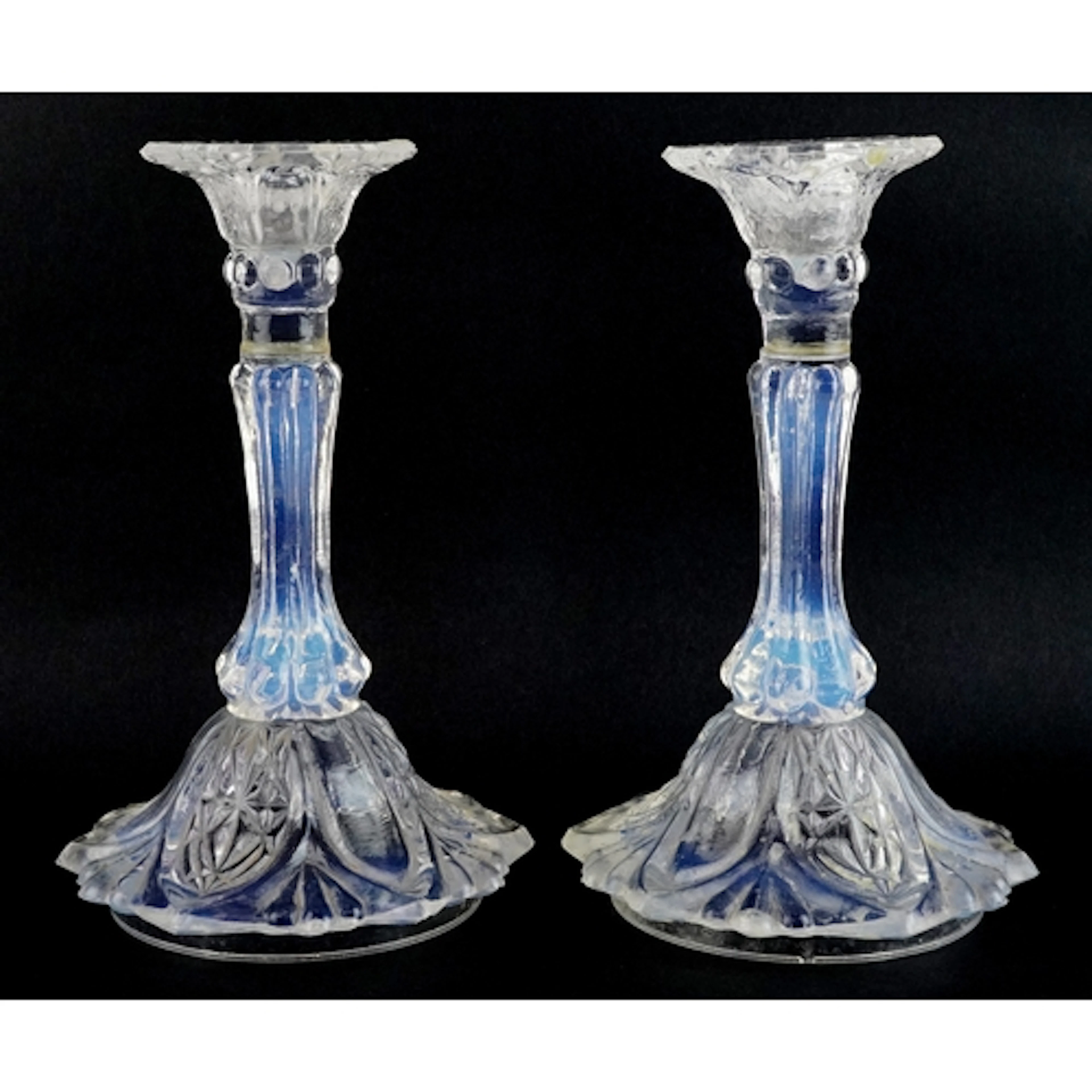 Pair of opaline glass candlesticks, each 18cm high.