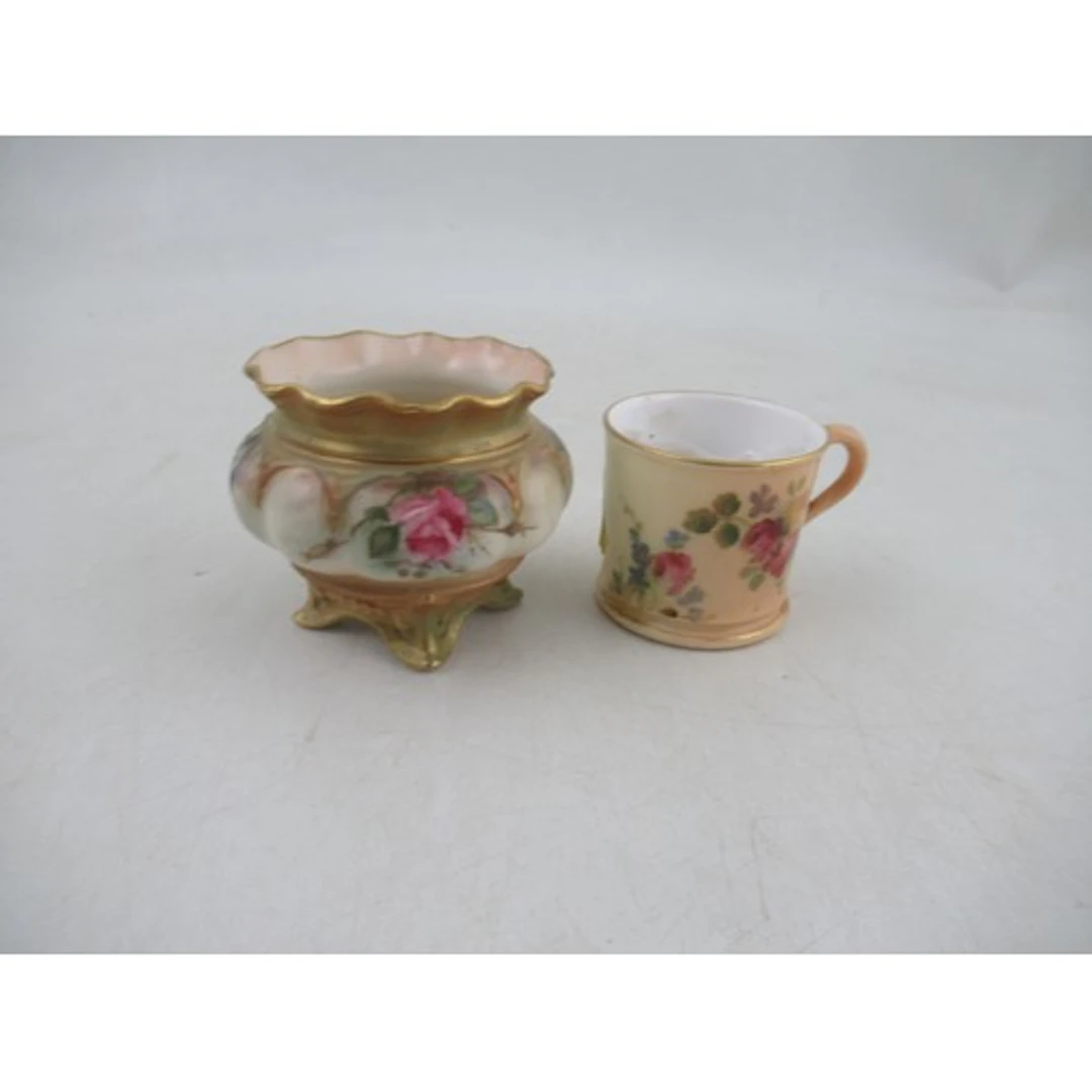A Royal Worcester miniature vase, decorated with flowers, sh...