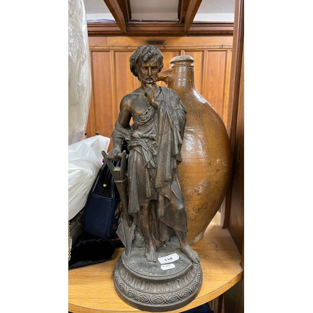 Bronze effect figure of a classical worker.