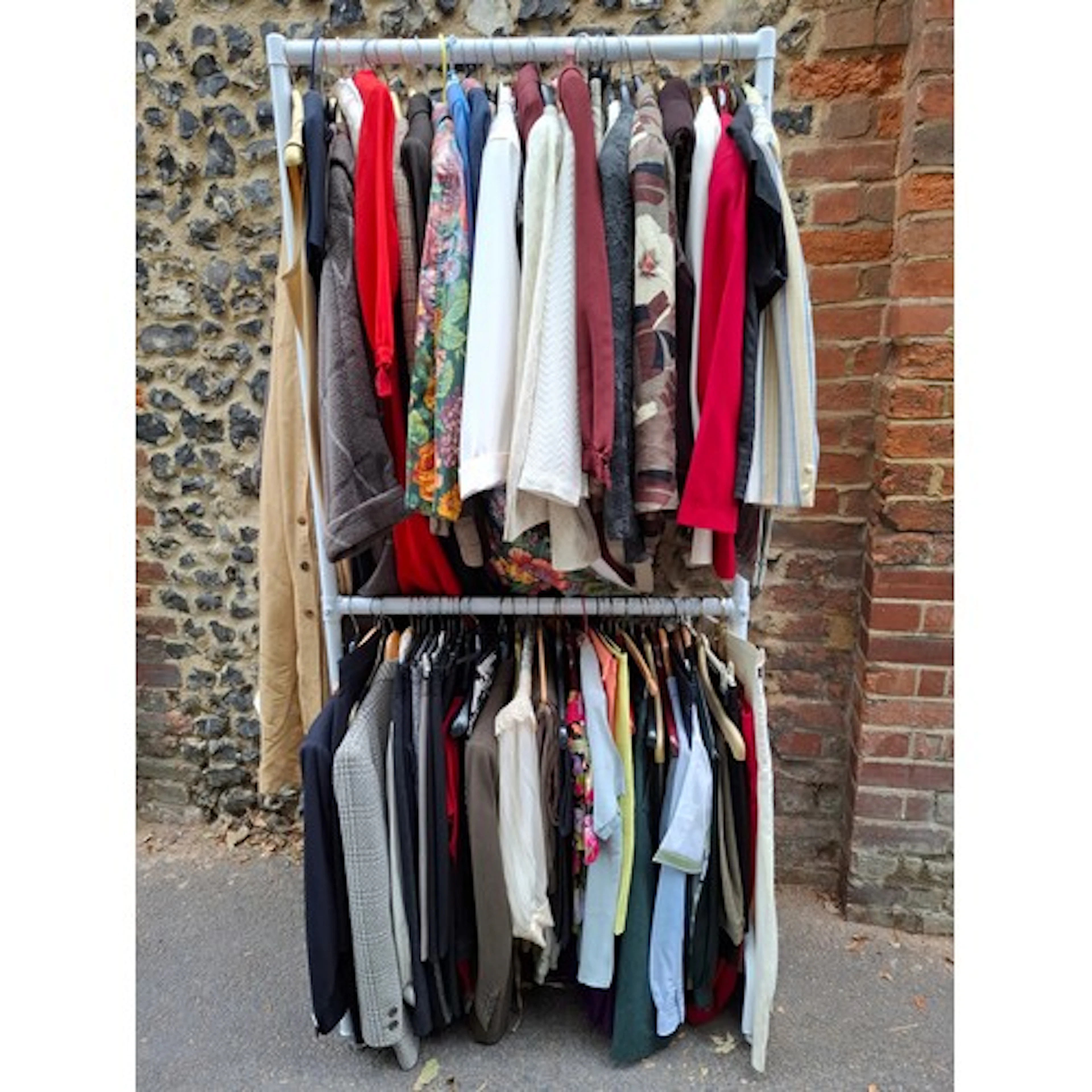 A complete rail of ladies clothing, mainly separates Europea...
