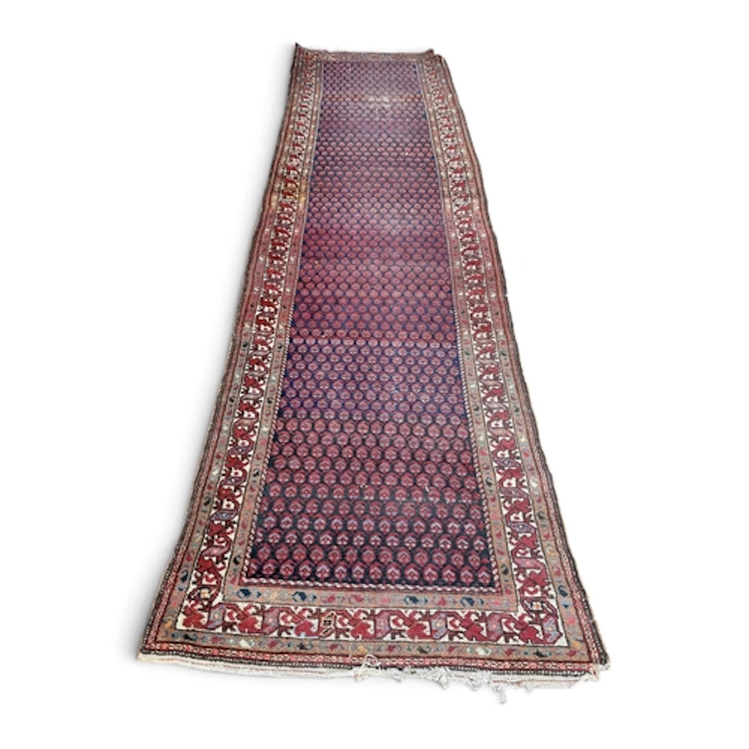 A PERSIAN RUNNER 400cm L x 98cm W