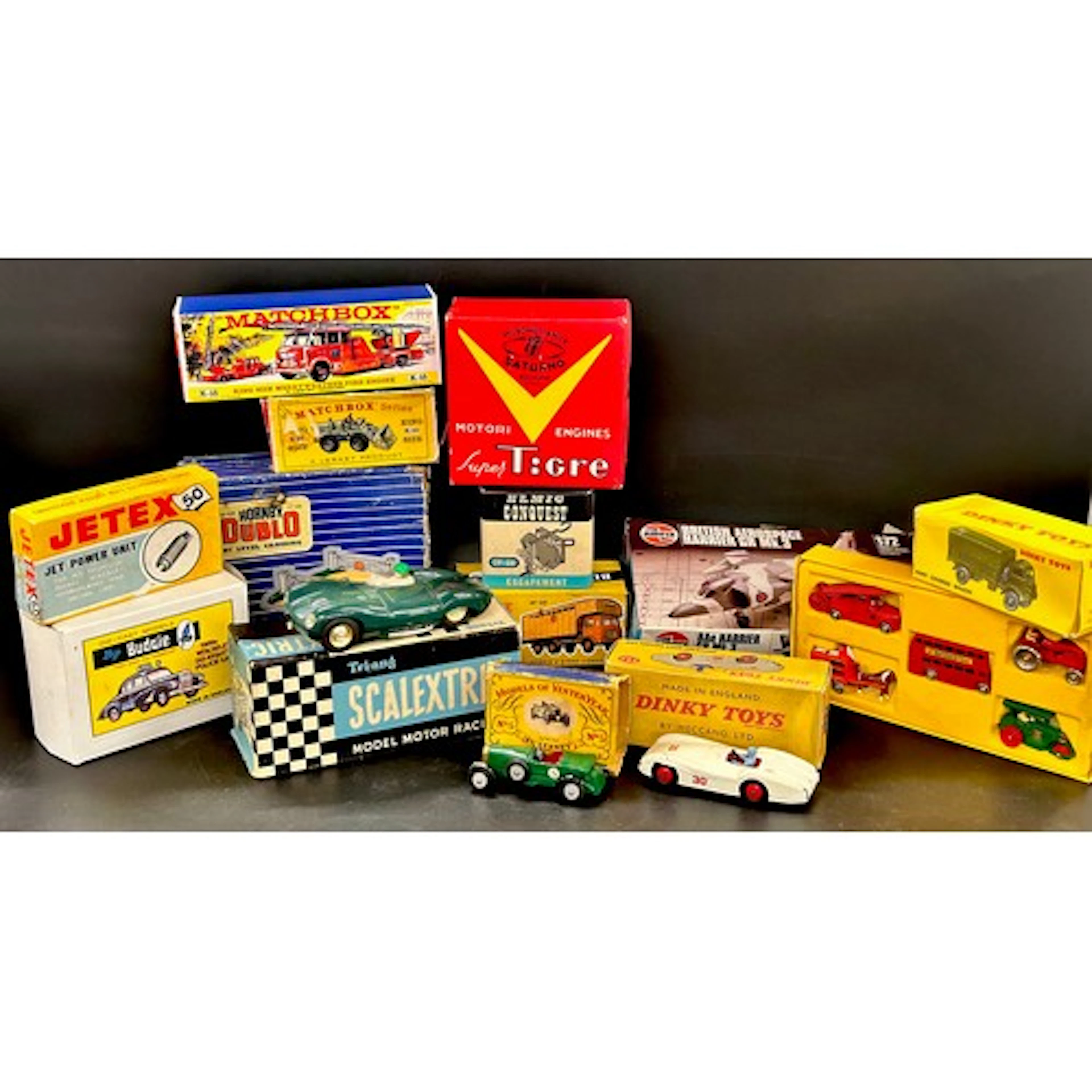 A collection of boxed mainly die-cast model vehicles, includ...
