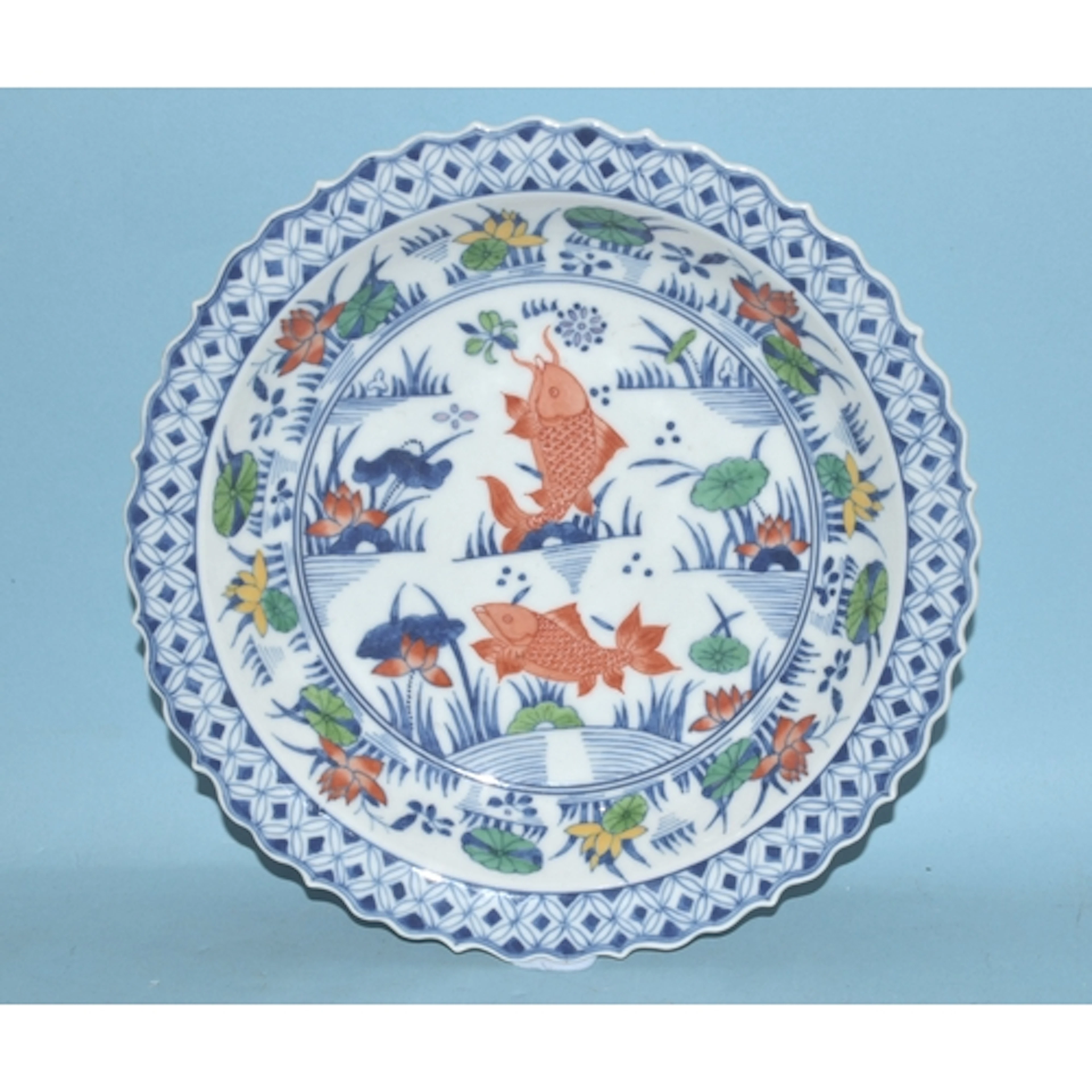 A Chinese Doucai-style carp and lily dish with shaped rim, a...