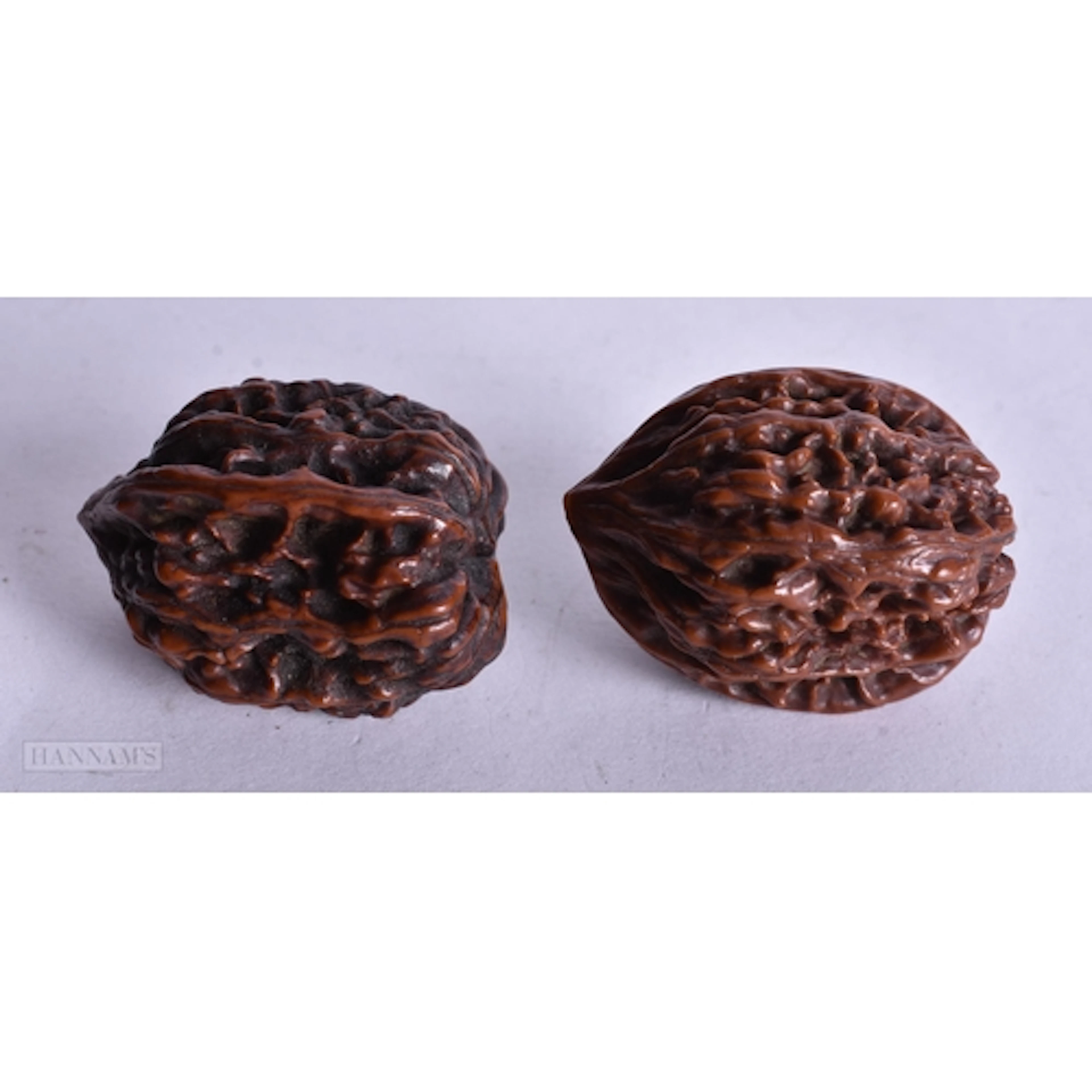 TWO CHINESE QING DYNASTY WALNUTS. 3.75 cm x 3 cm. (2)