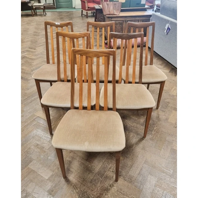 A set of six G-plan teak slat backed dining chairs with beig...