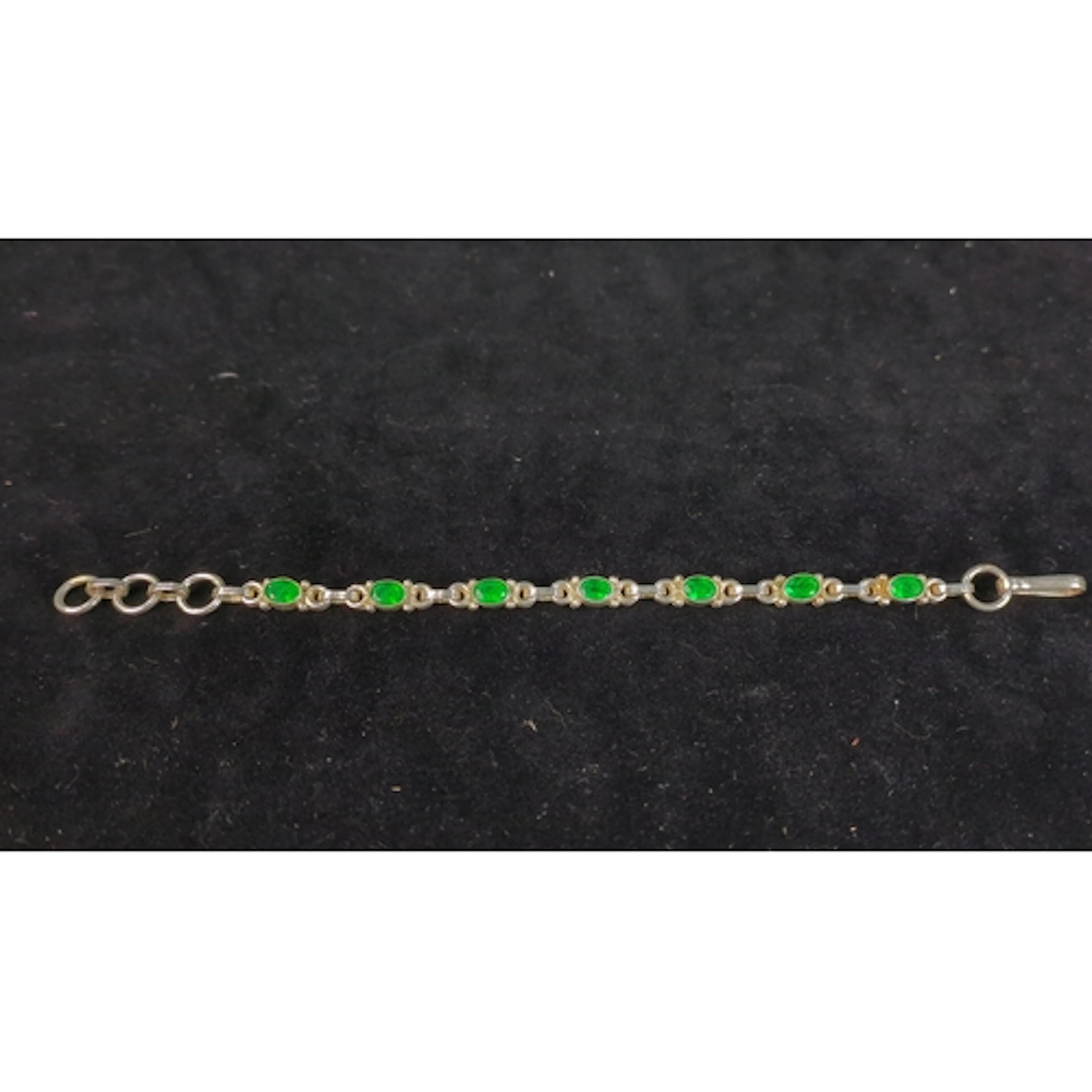 925-marked silver bracelet set with a series of oval, facete...