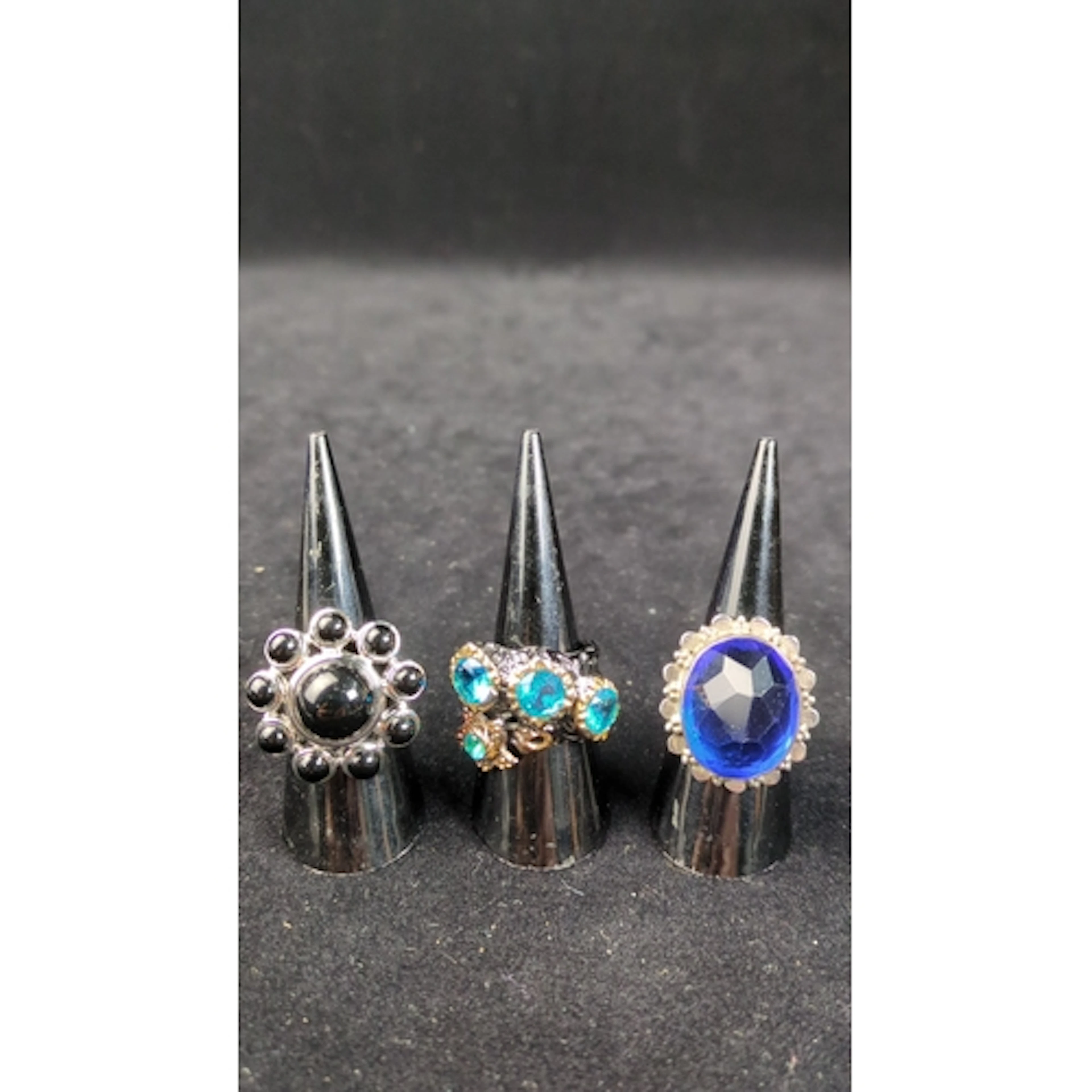 Three dress rings, one visibly stamped 925: one set with clu...