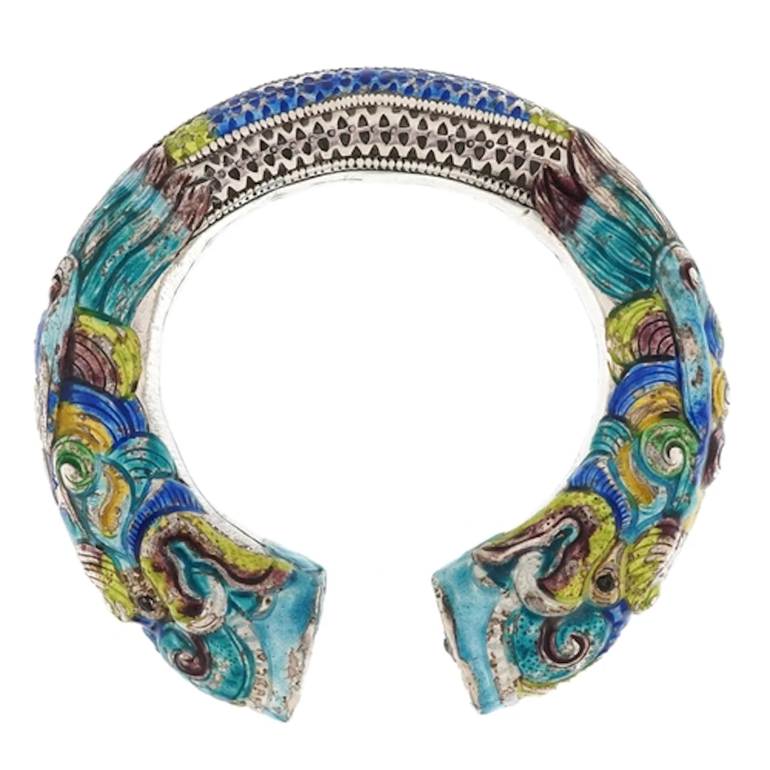Chinese white metal and enamel dragon head bangle, 10cm in l...