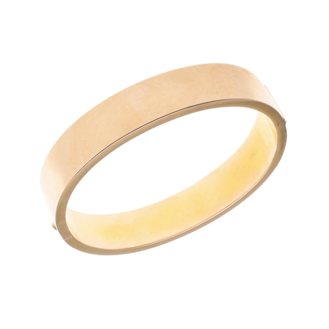A 15CT GOLD HALF HINGED BANGLE. of plain form, internal meas...