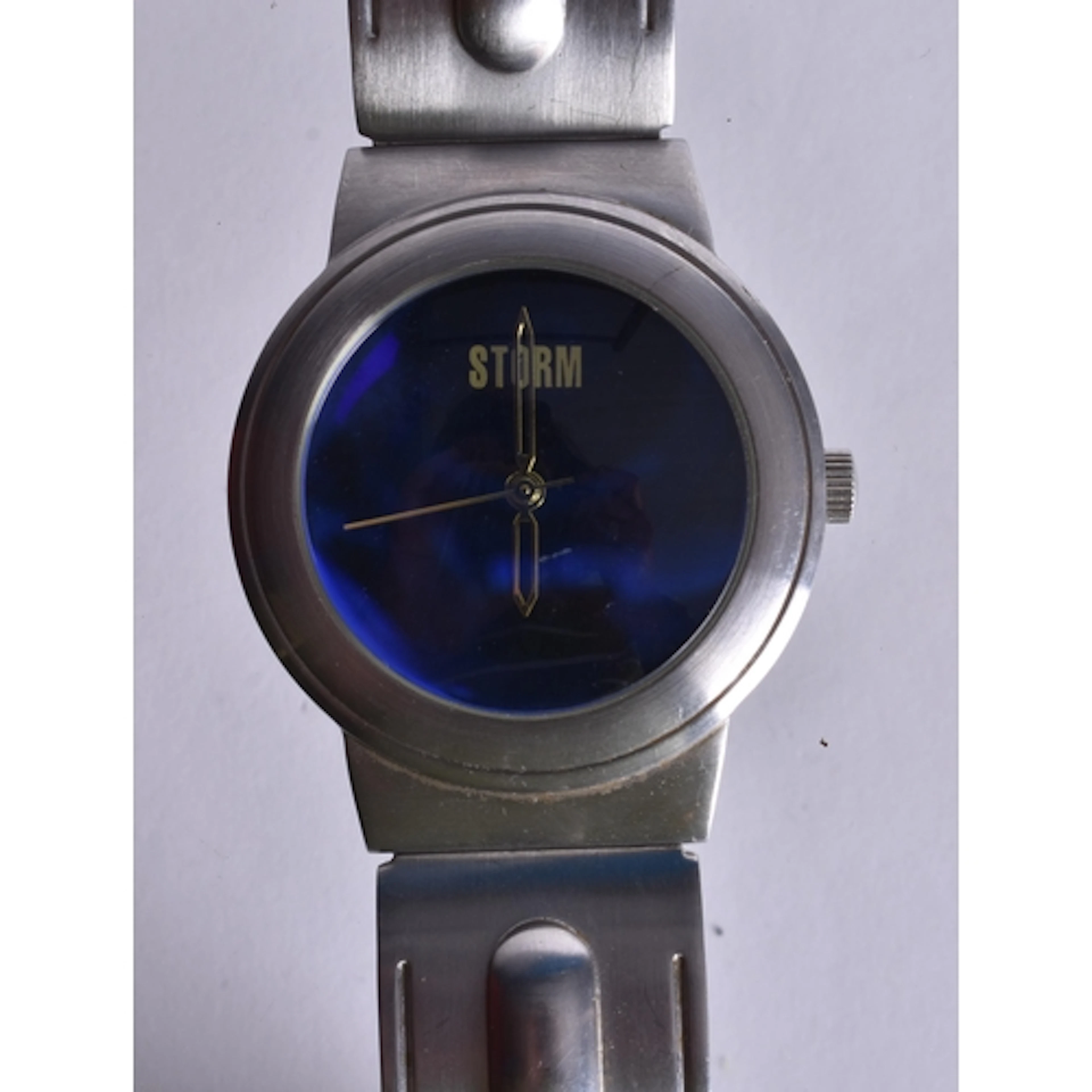 A Retro Storm watch featuring a Vibrant Blue Dial and a Brus...