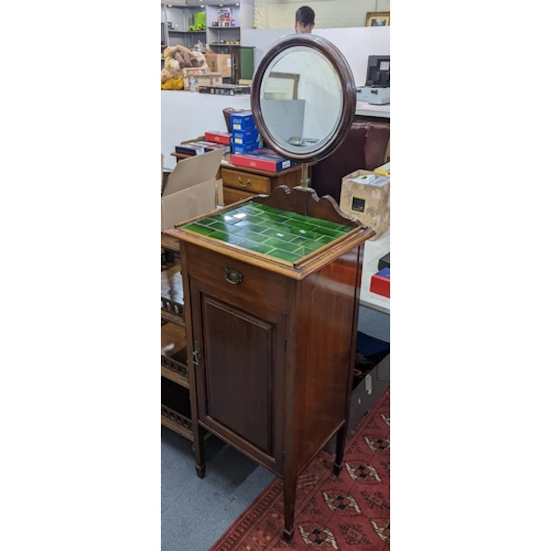 An early 20th century mahogany shaving stand having a mirror...