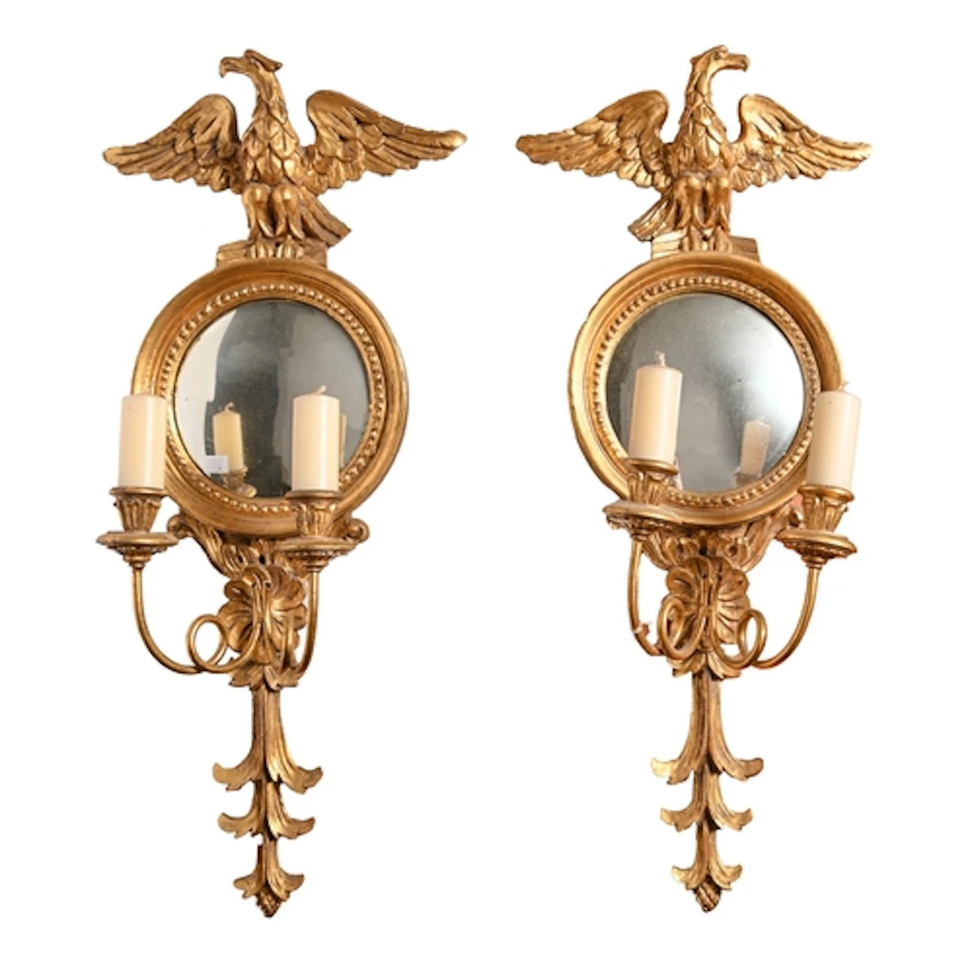 A pair of giltwood girandole, 20th c, the convex mirror and ...