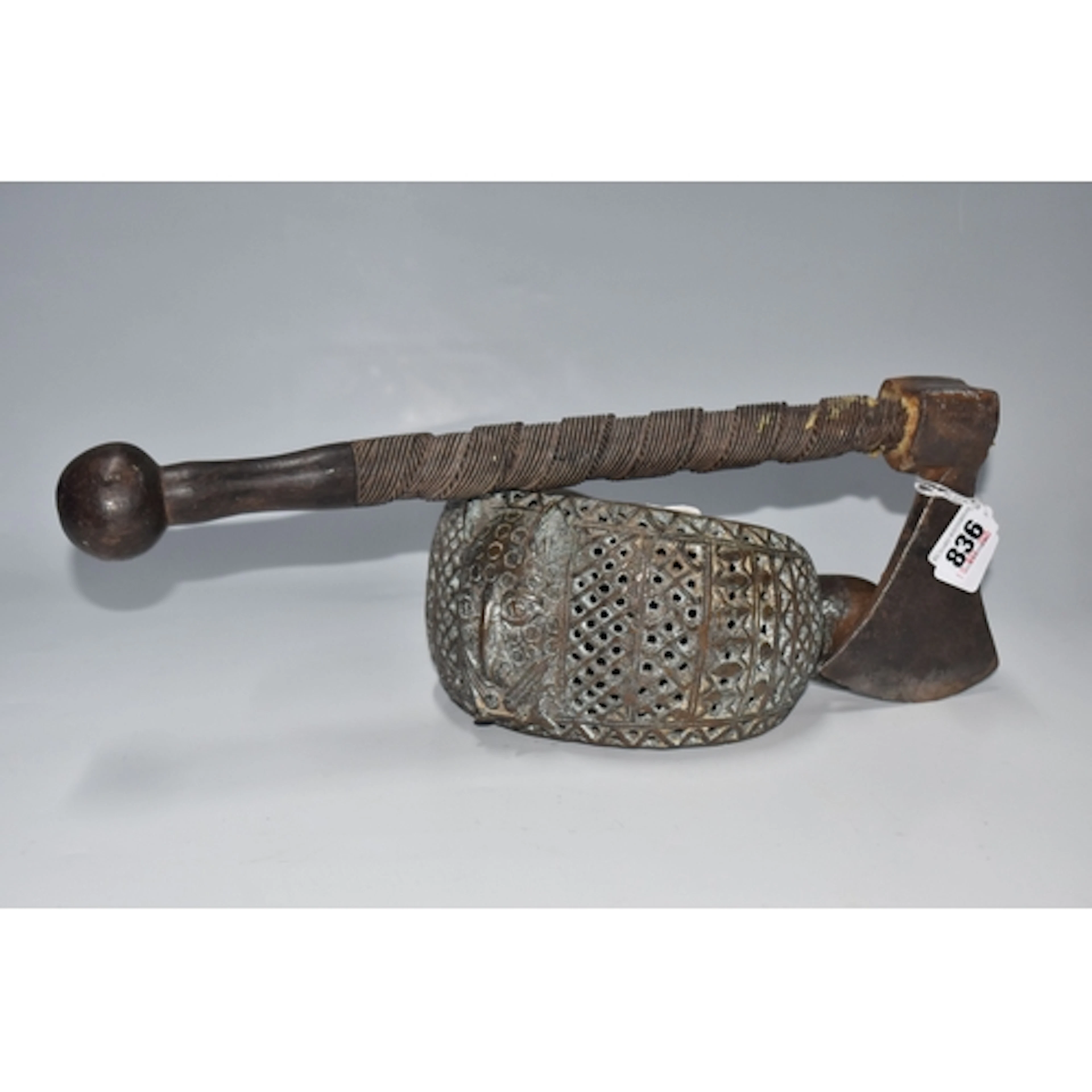 TWO PIECES OF VINTAGE AFRICAN ITEMS, to include a hollow bro...