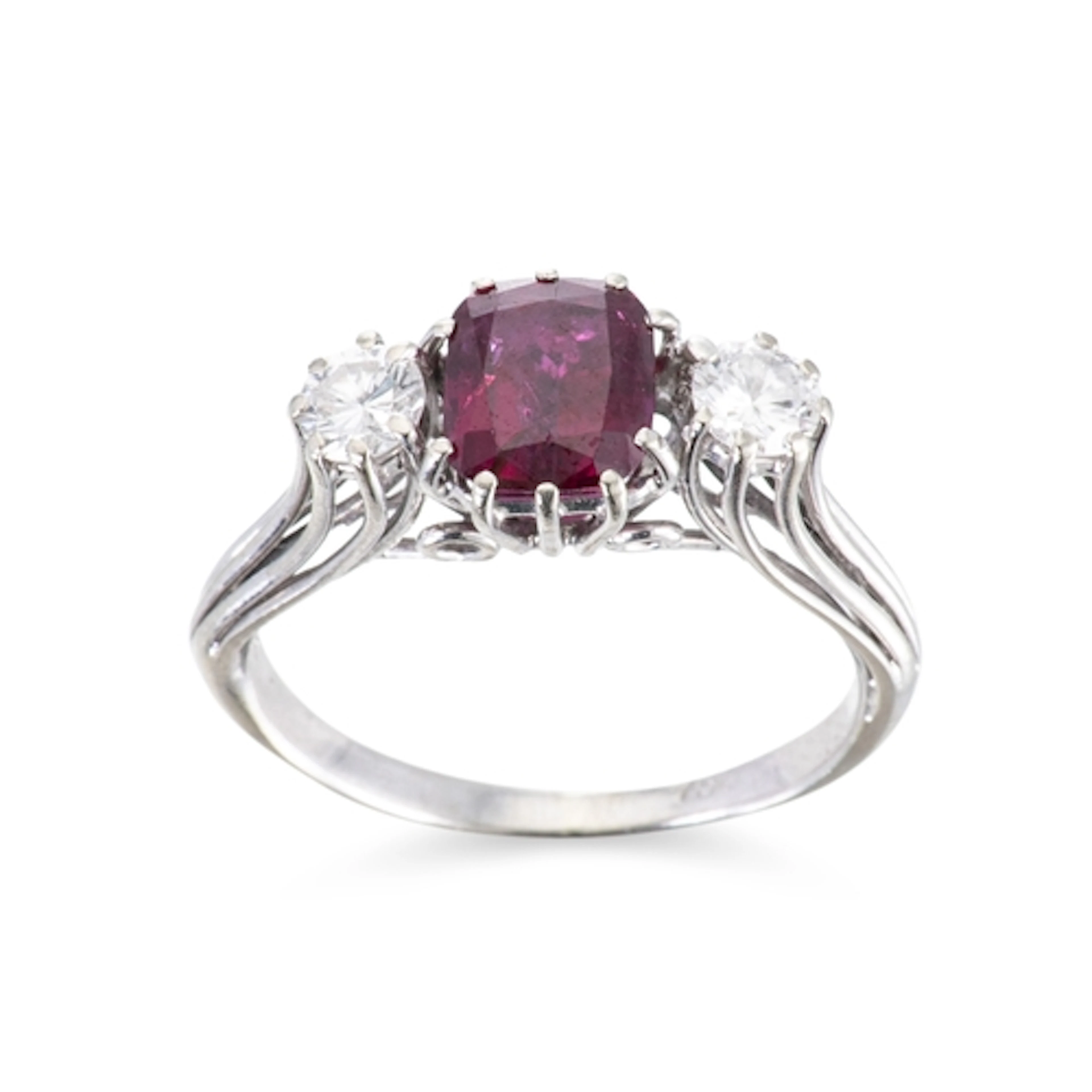 A GARNET AND DIAMOND THREE STONE RING, mounted in 18ct white...