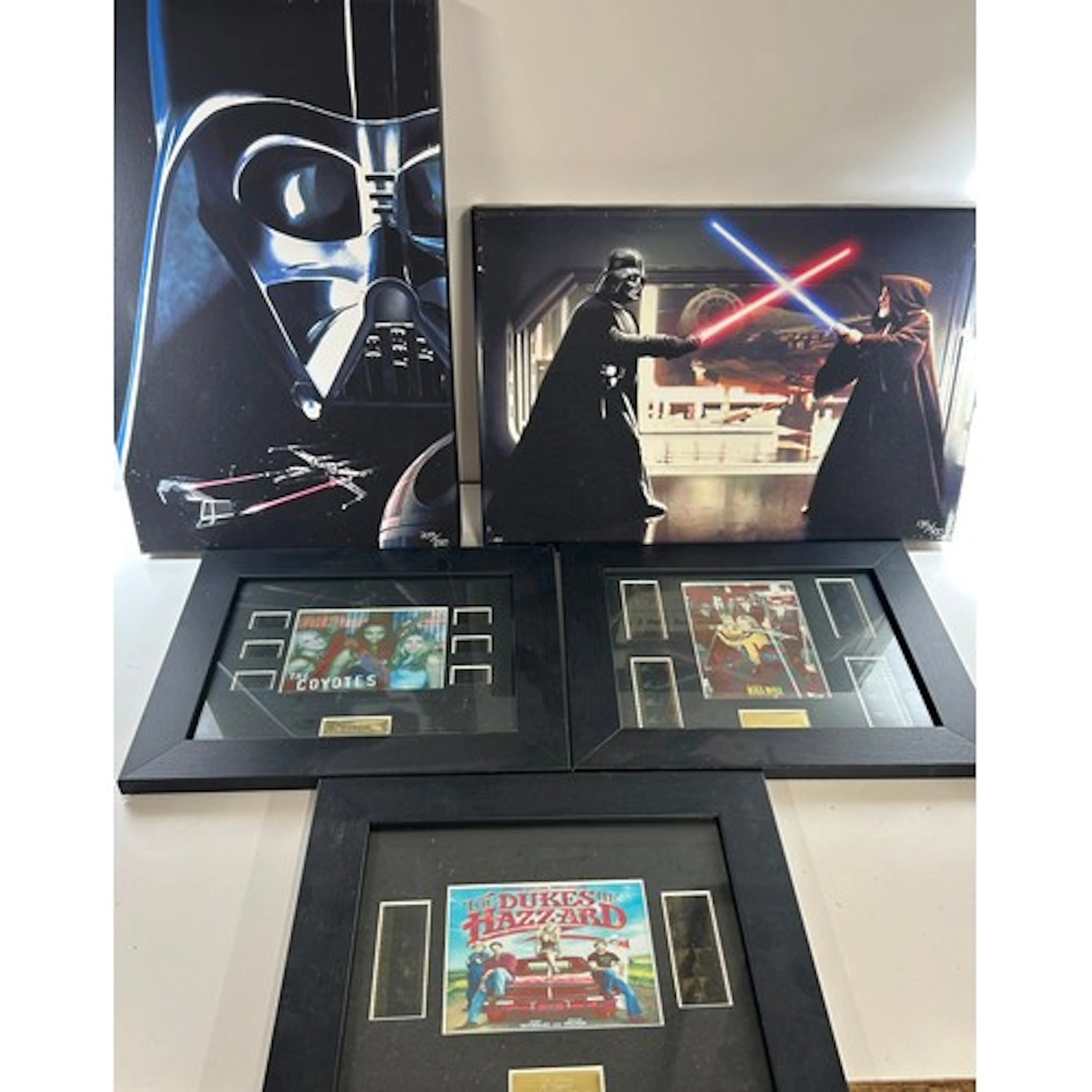 12 framed displays with original film strip cuttings and pho...