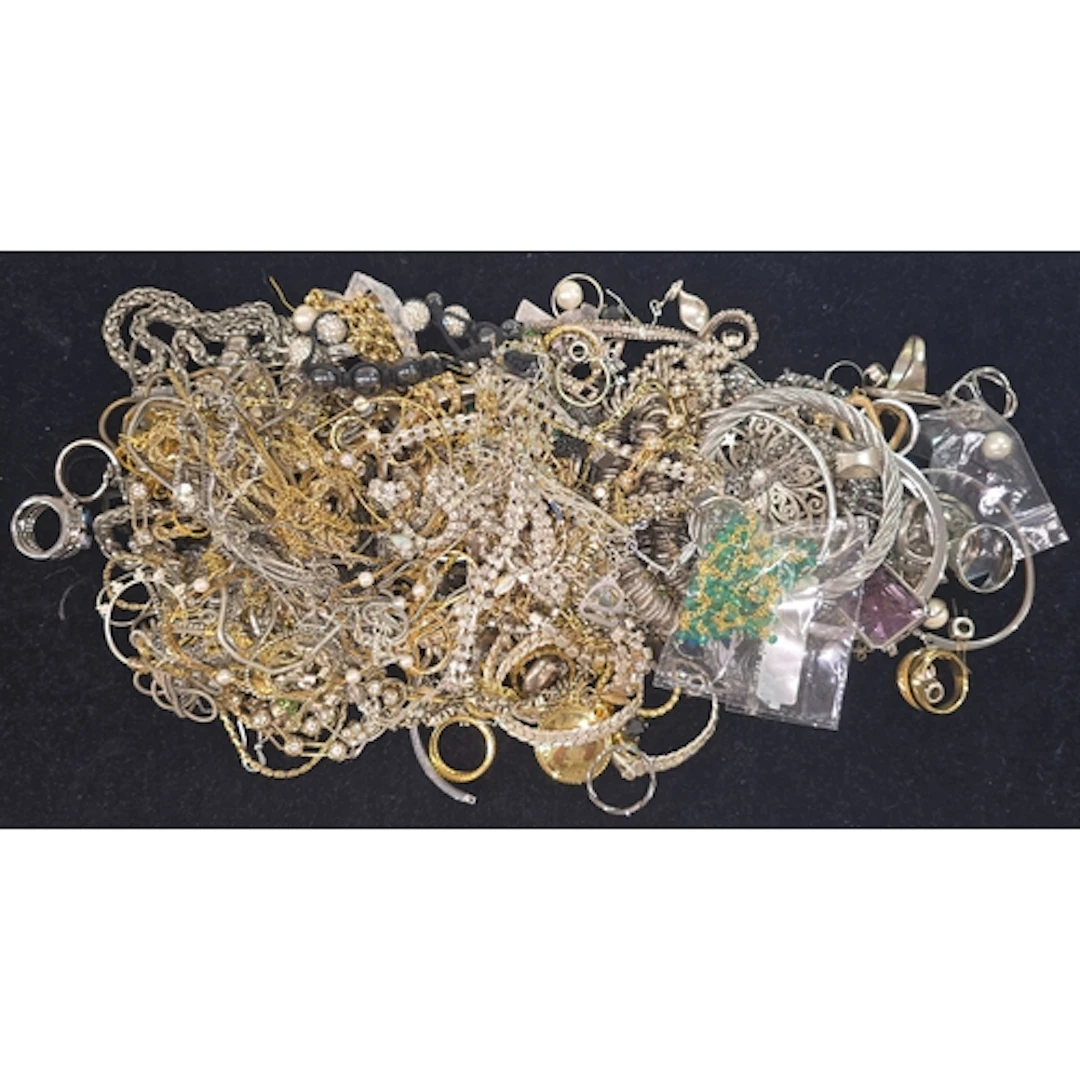 A bag containing a collection of costume jewellery.
