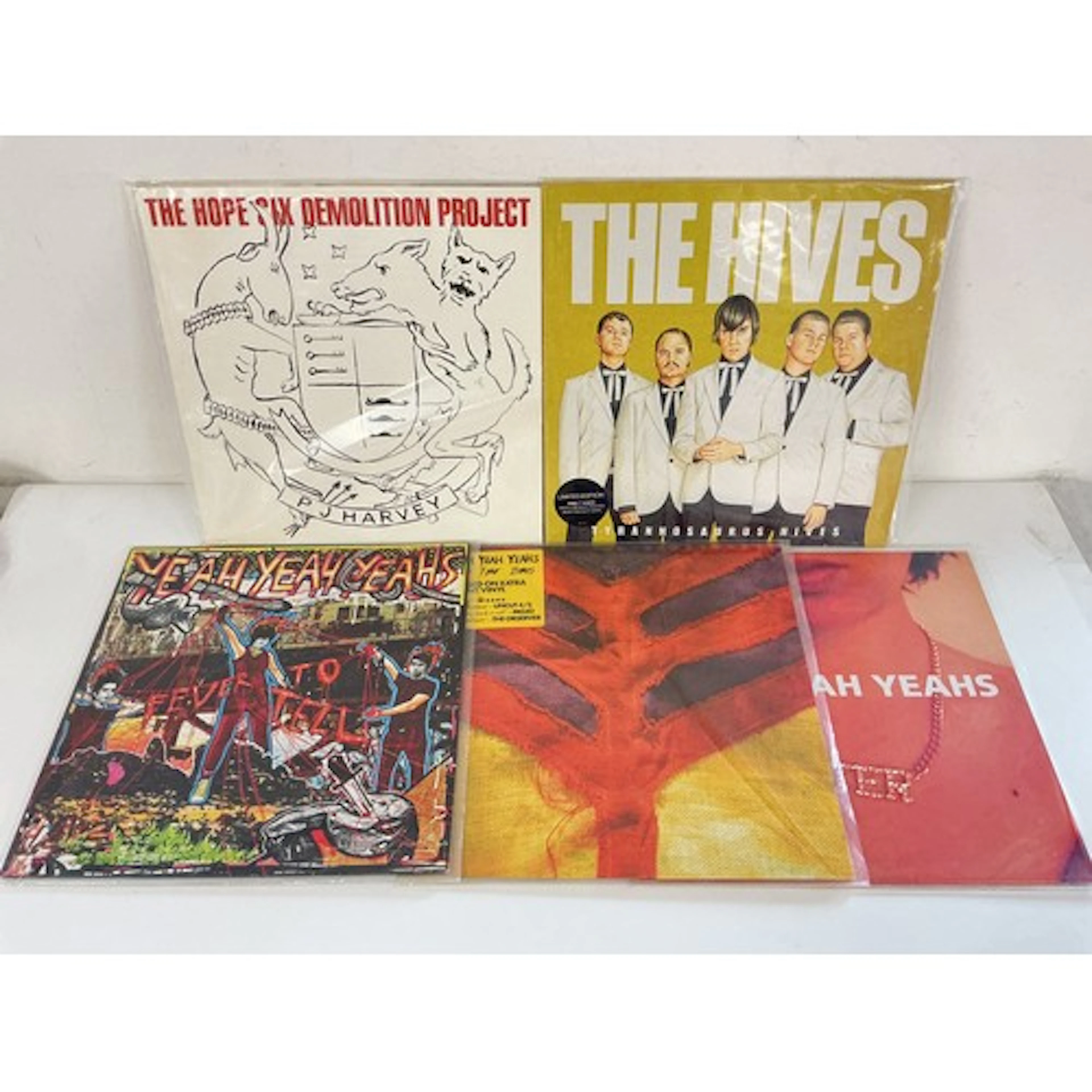 Four alt rock LPs and a 12” single by Yeah Yeah Yeahs, The H...