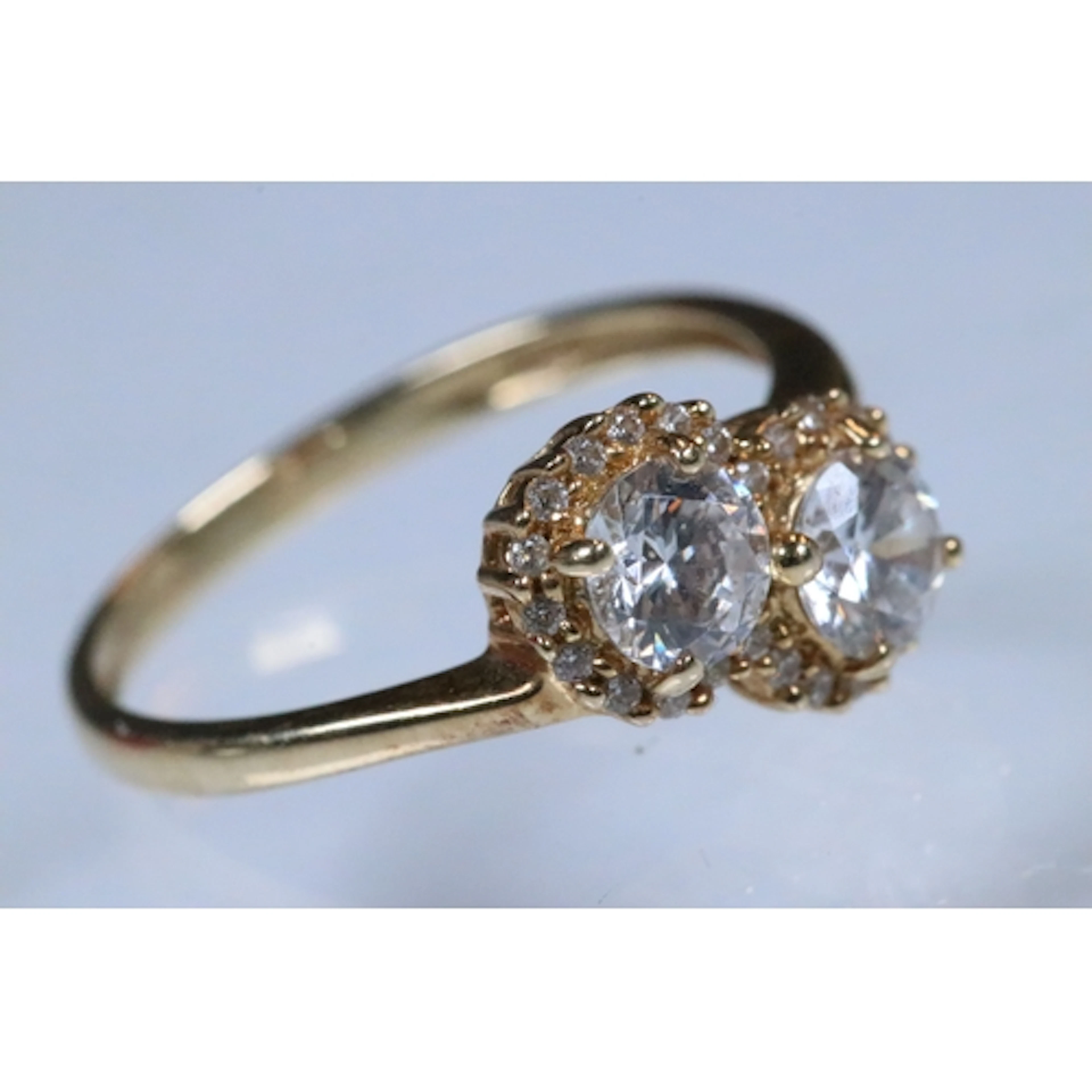 14ct gold and cz two stone ring being set with two round cut...