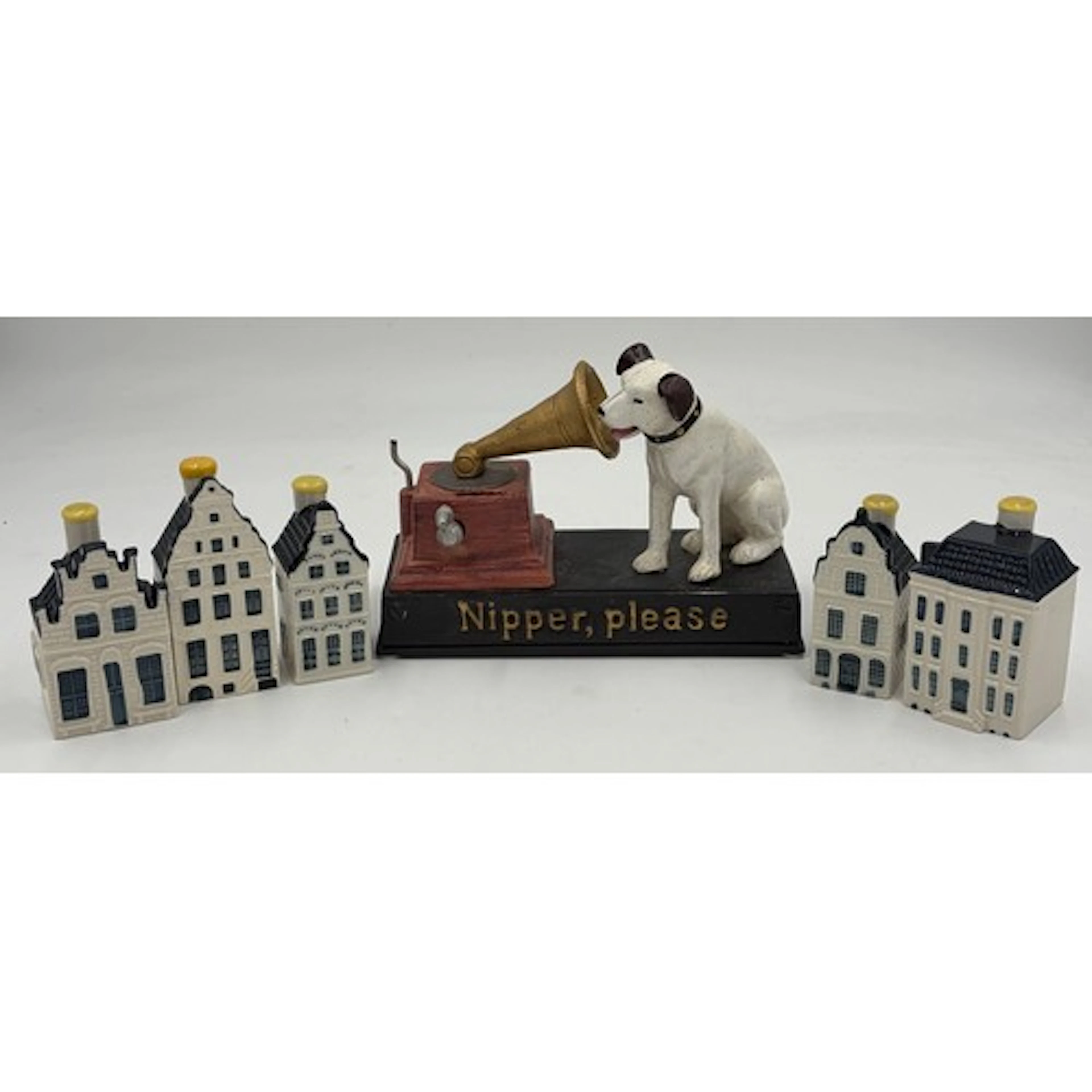 A reproduction cast iron musical money box 'Nipper Please' t...