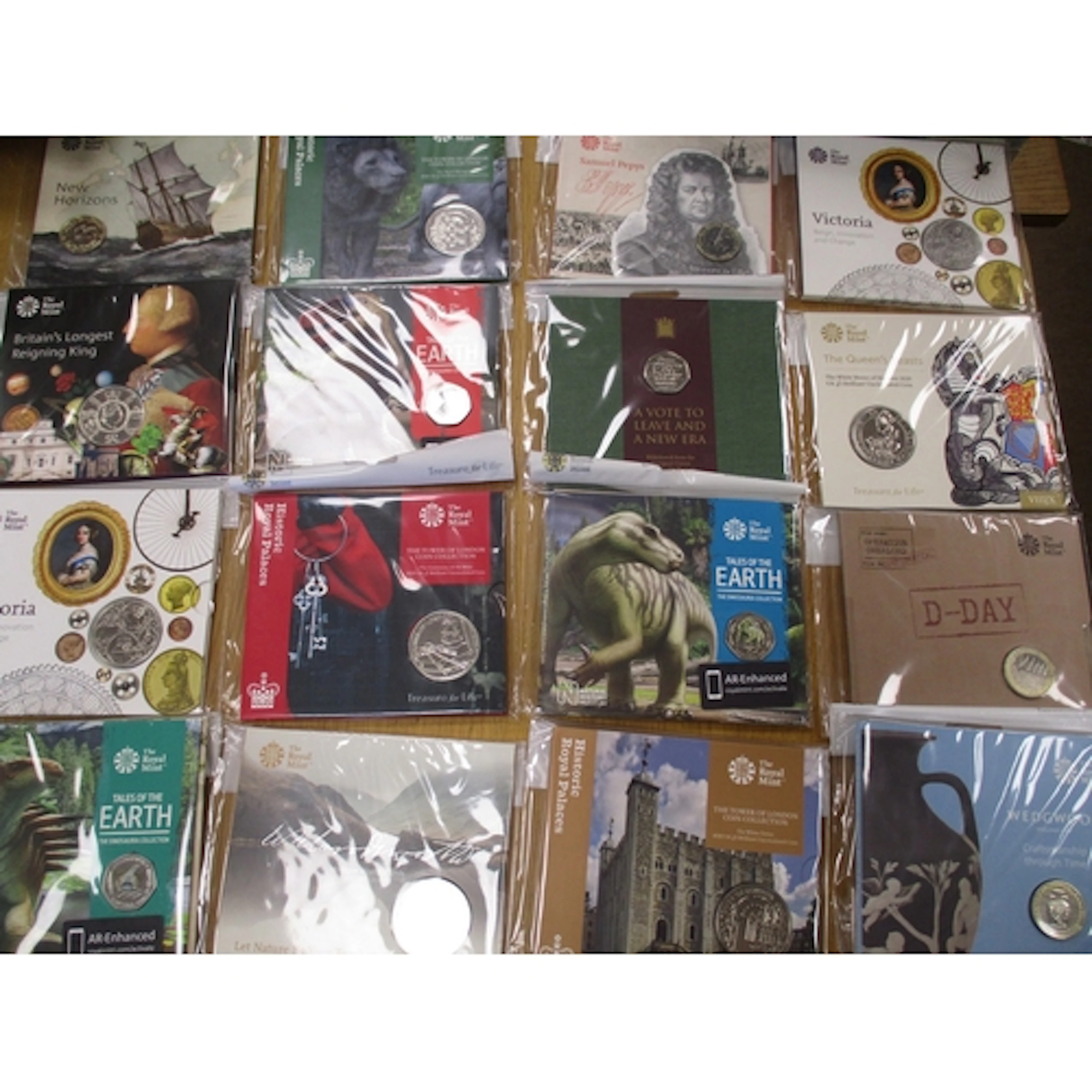Collection of Royal Mint uncirculated folders, including £5 ...