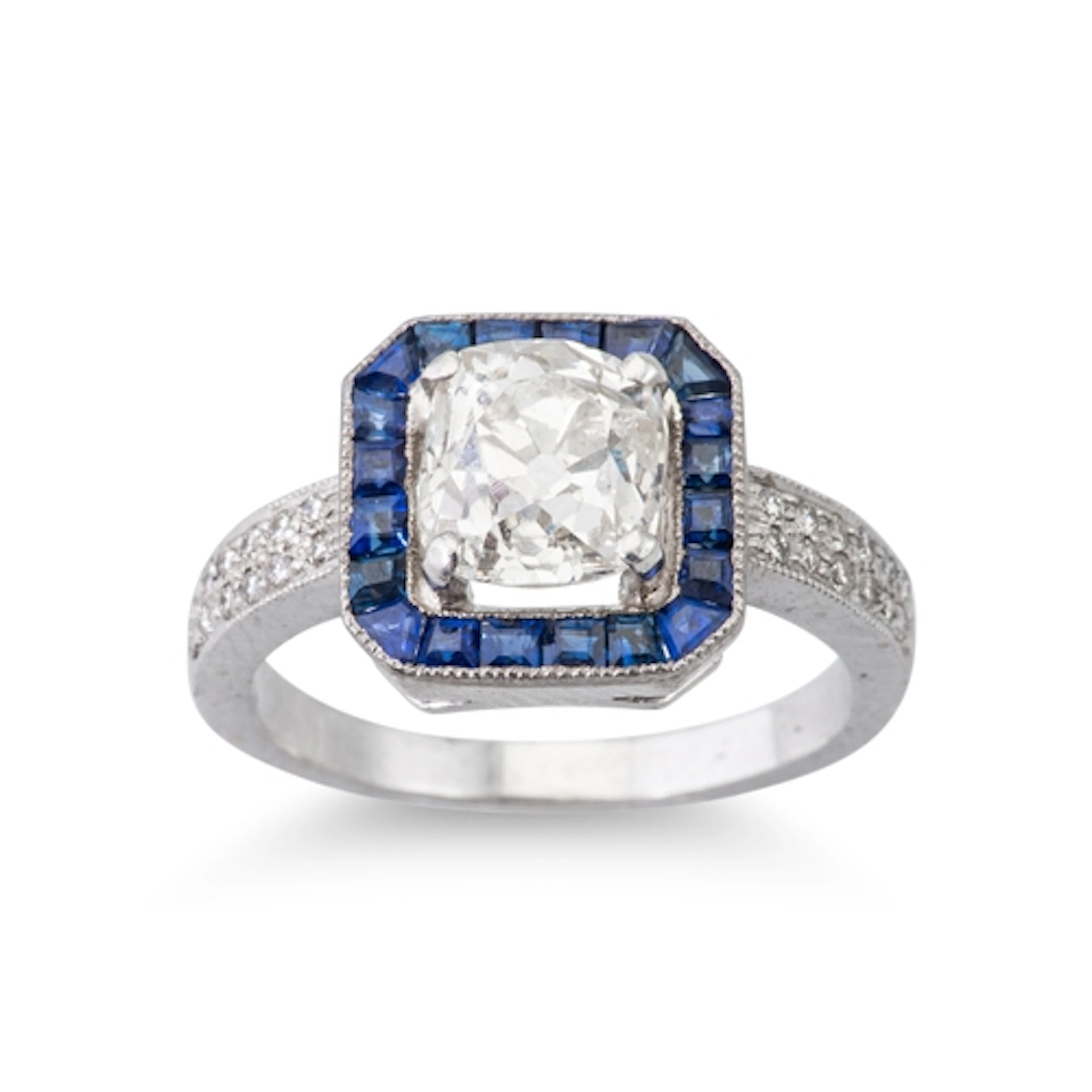 AN ART DECO STYLE DIAMOND AND SAPPHIRE CLUSTER RING, the old...
