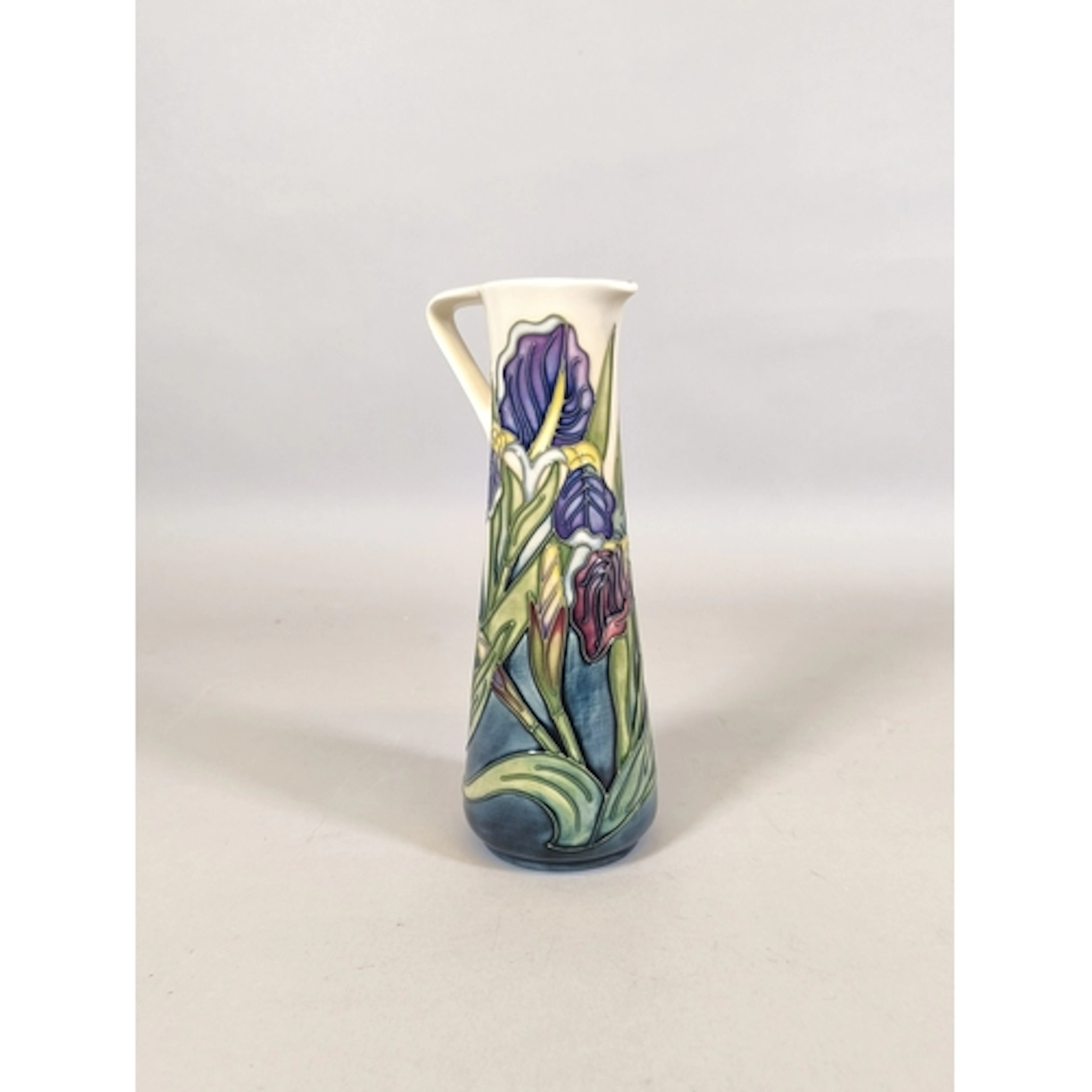 Moorcroft Iris pattern tube lined pottery jug, Designed by R...