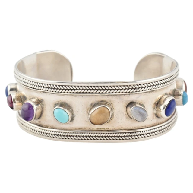A white metal cuff bracelet bangle set with ten coloured cab...