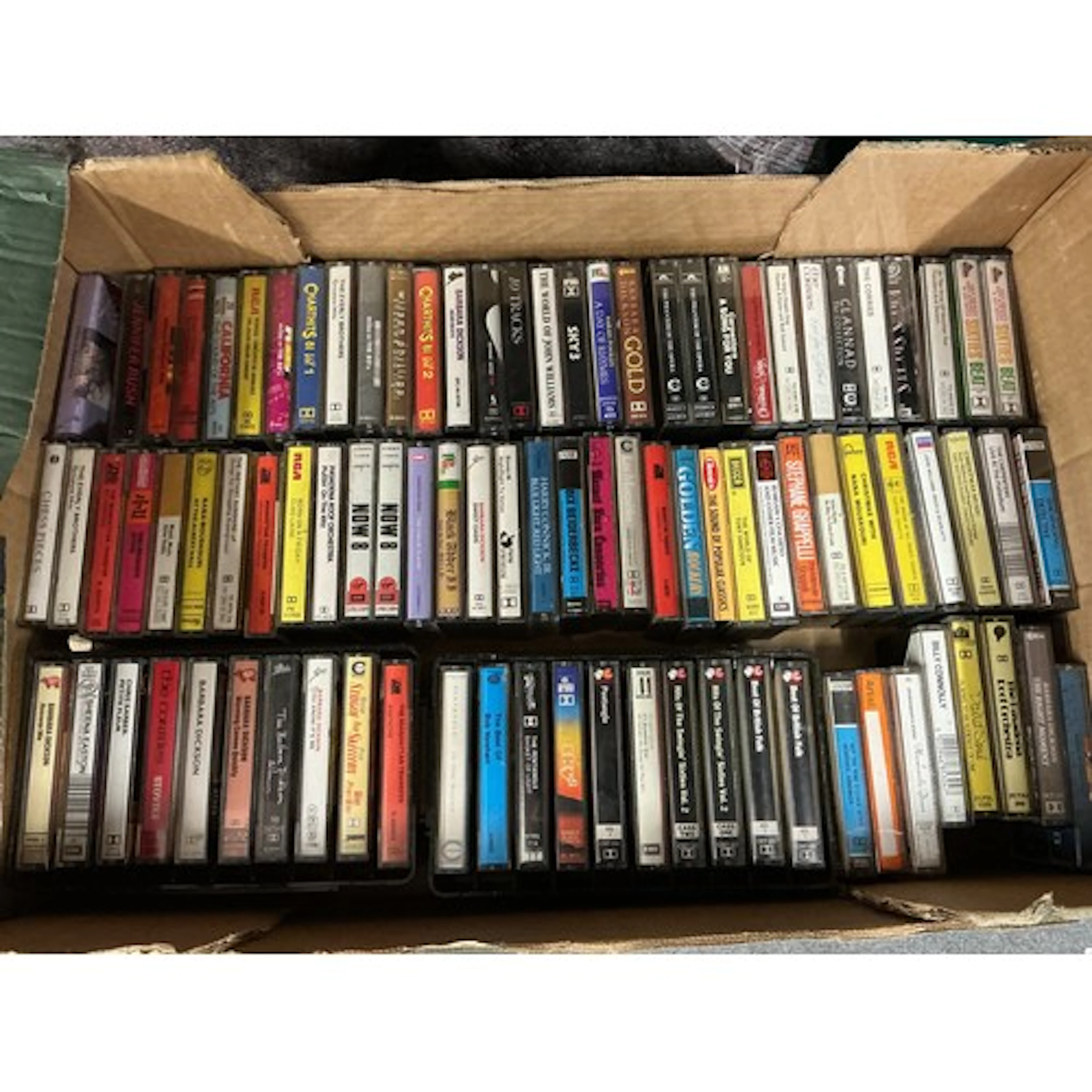 A collection of audio cassettes by various artists including...