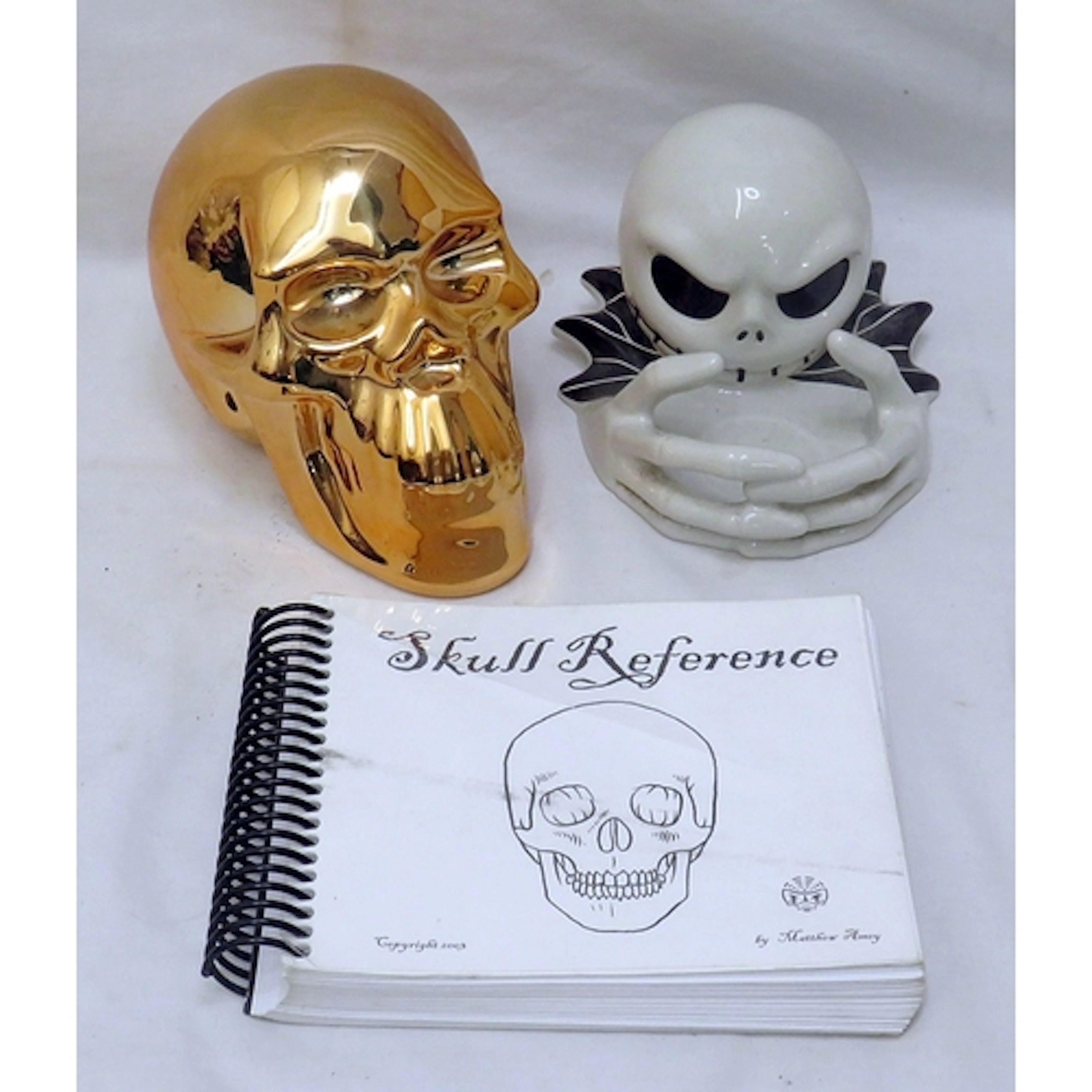 Copper coloured skull & skull tealight holder, based on Tim ...