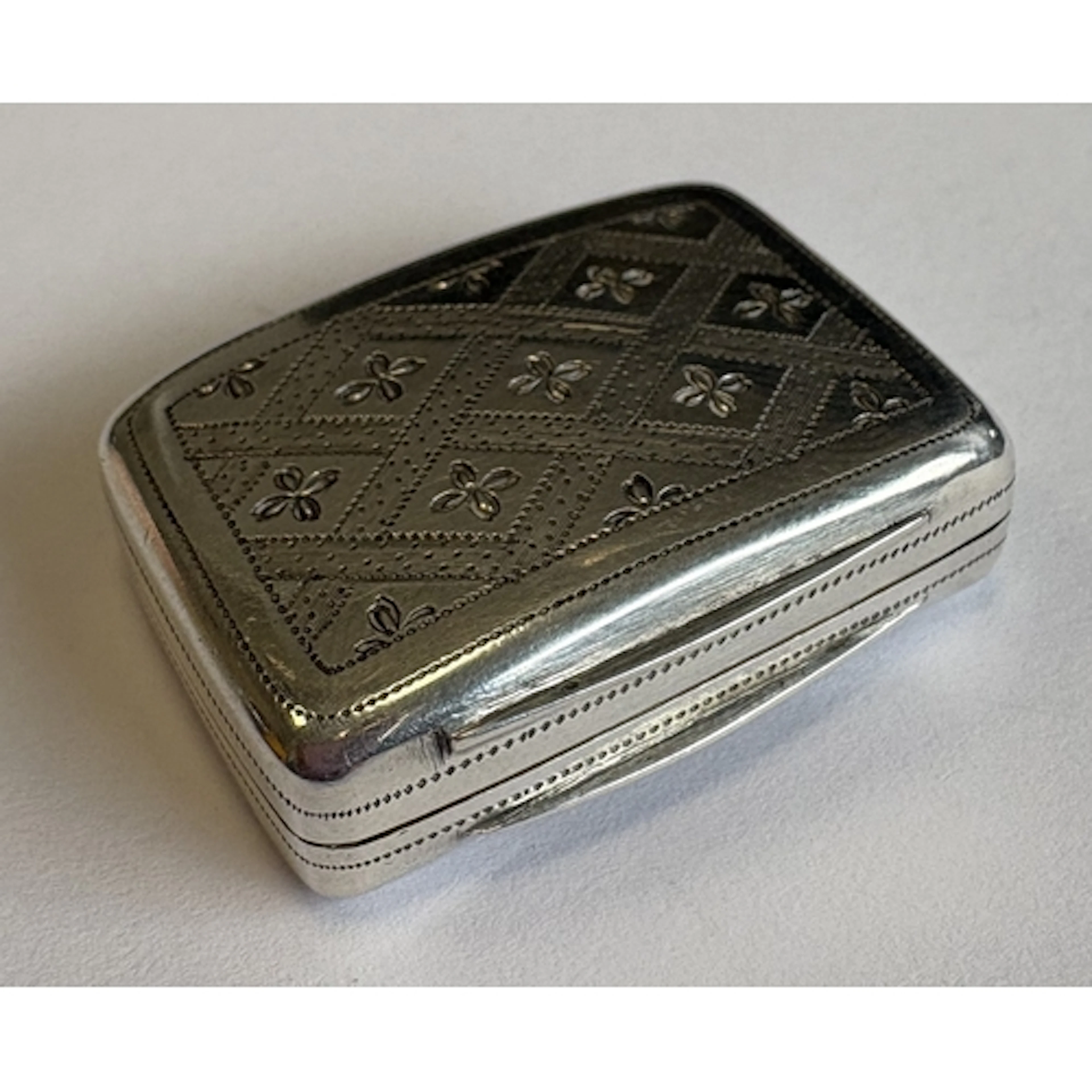A Georgian silver vinaigrette with bright-cut decoration. Bi...