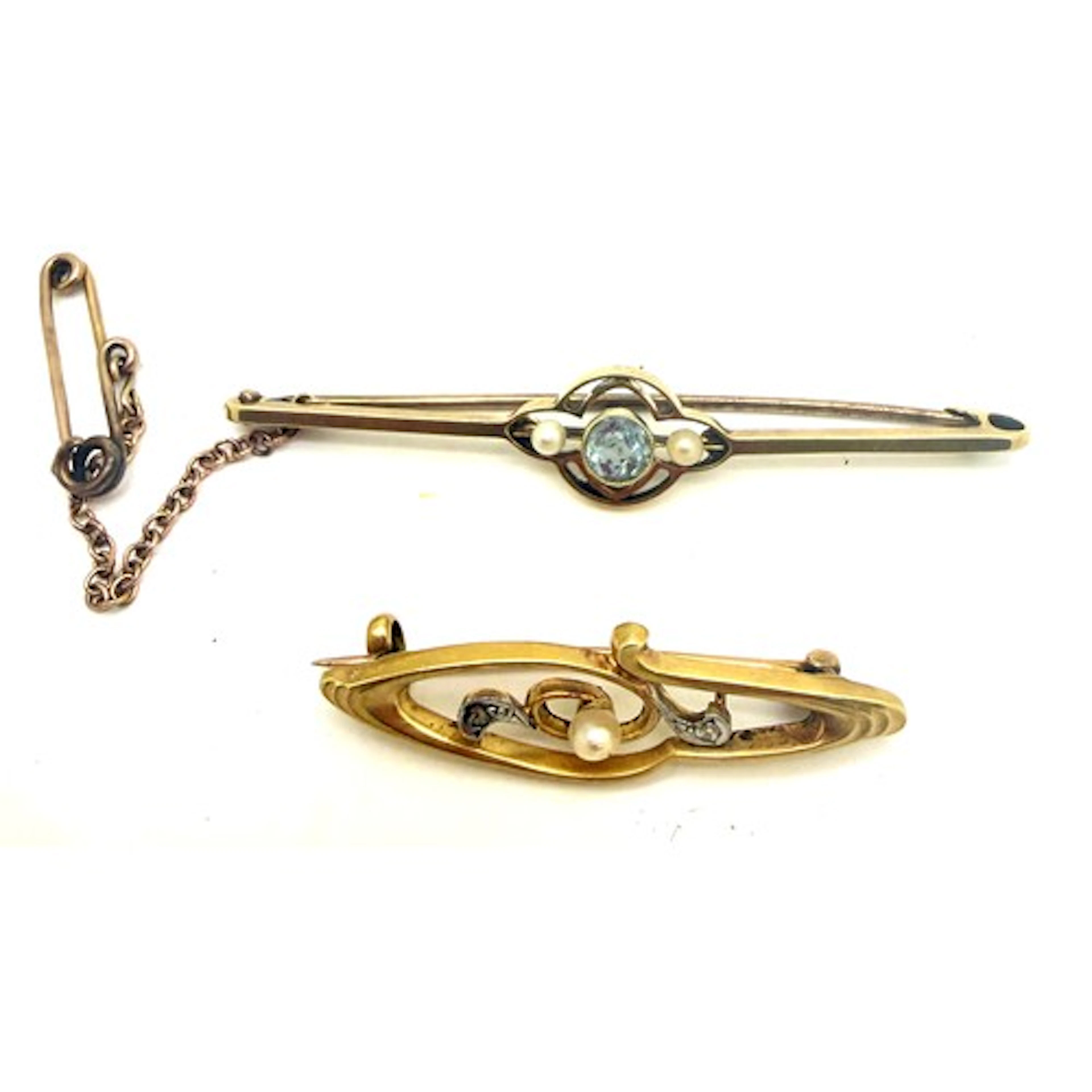 Two 15 carat gold bar brooches, one set with aquamarine and ...