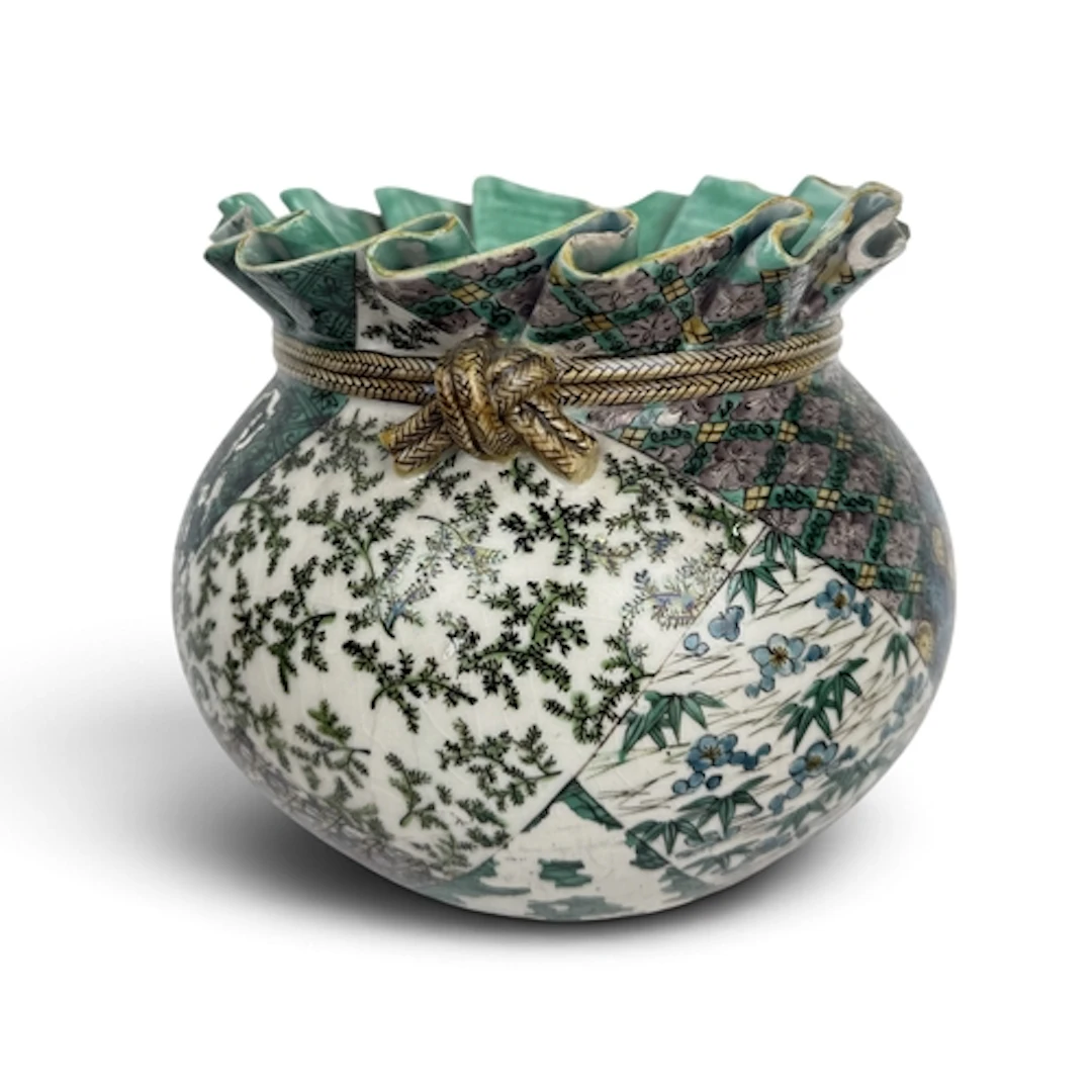 A JAPANESE PORCELAIN VASE, IN THE FORM OF A SEALED BASKET 14...