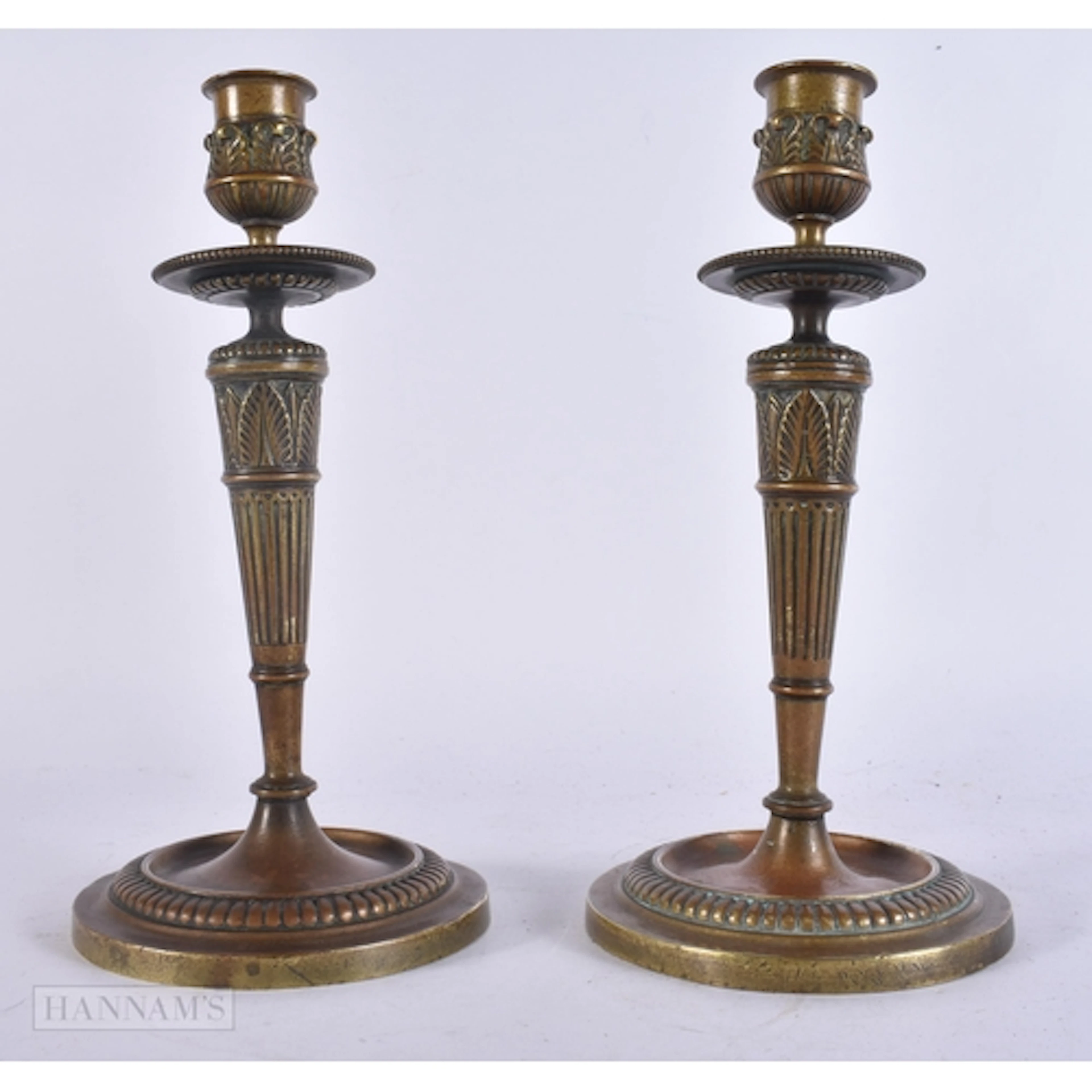 A PAIR OF 19TH CENTURY FRENCH BRONZE CANDLESTICKS signed F D...