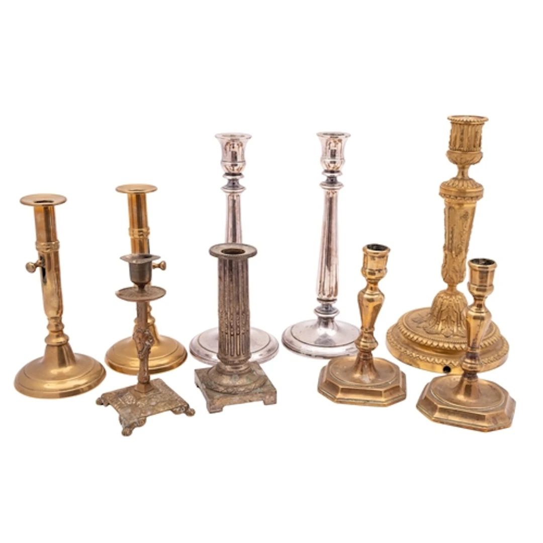 A collection of metal candlesticks, 19th and 20th century; i...