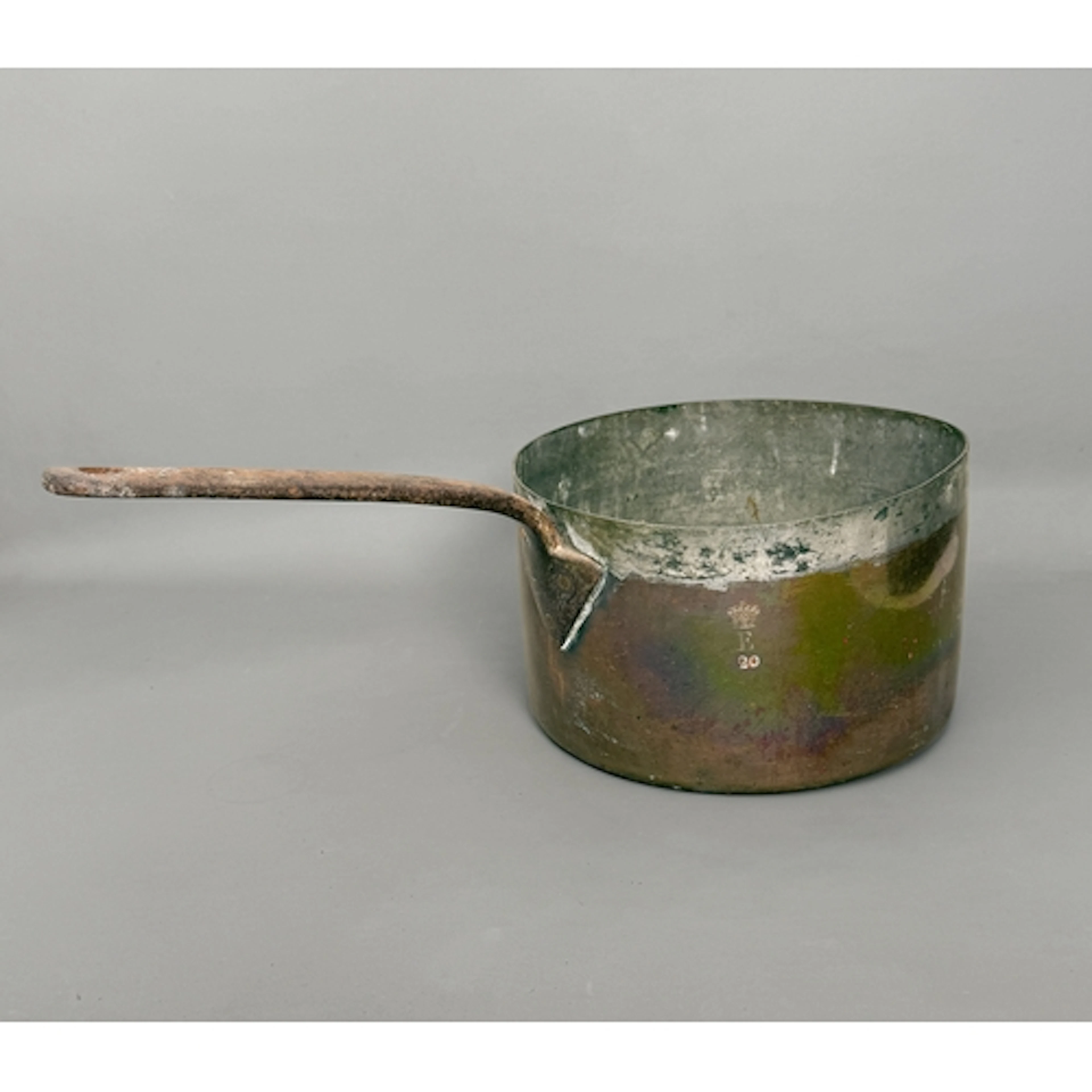 An early twentieth century large copper saucepan - with iron...