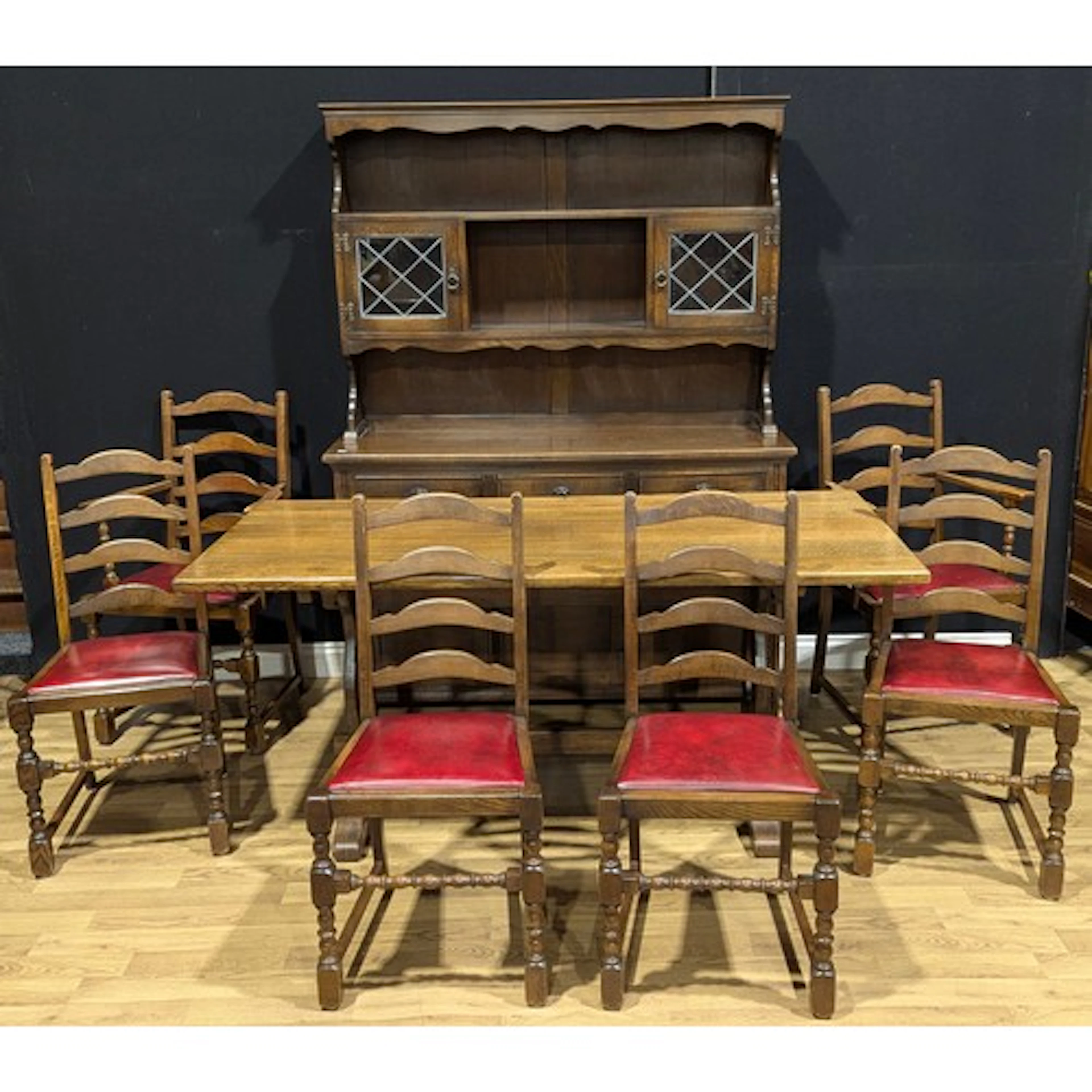 An oak trestle dining table, 74.5cm high, 167.5cm long, 75.5...