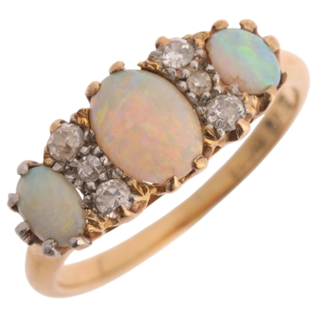 An Antique 18ct gold nine stone opal and diamond half hoop r...