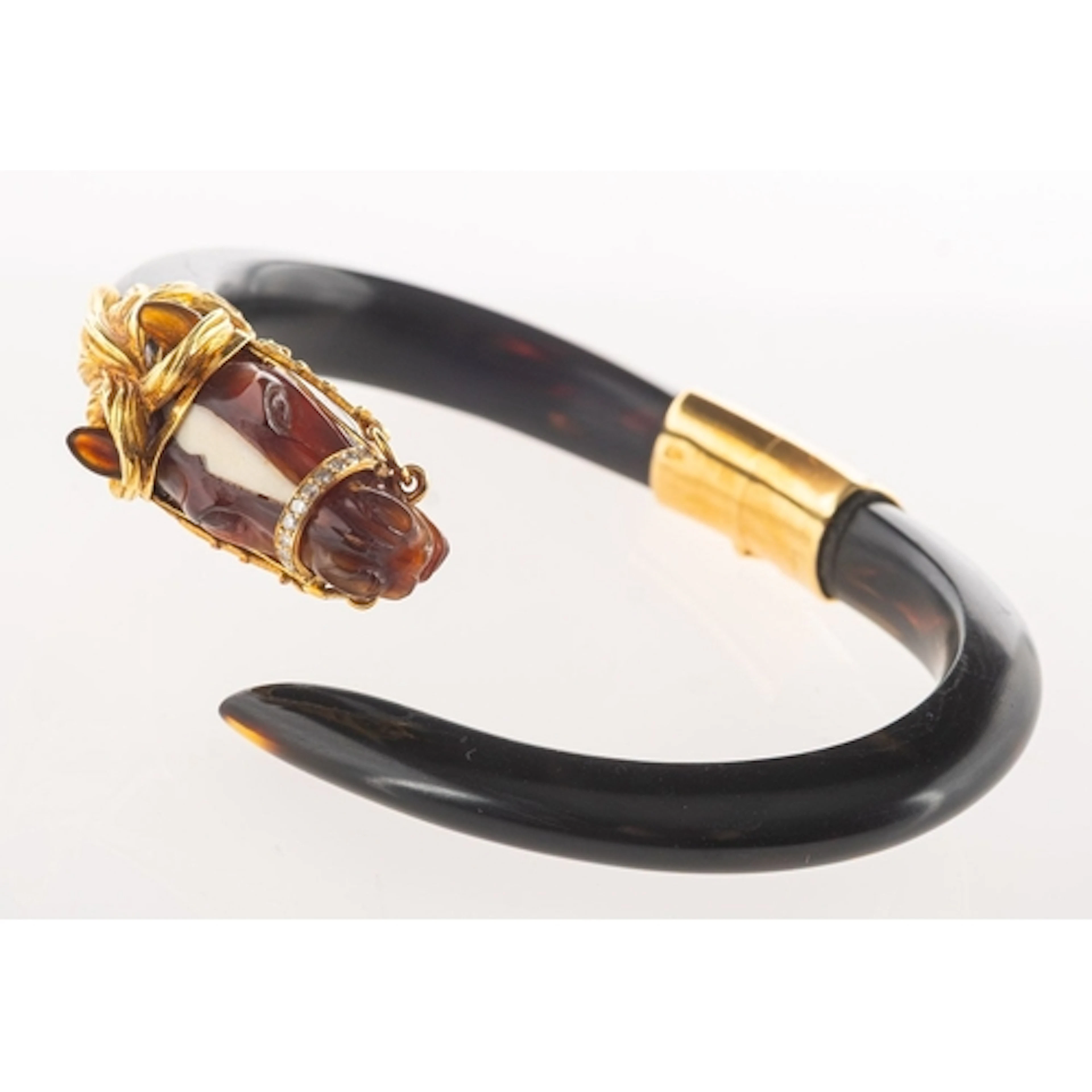Gay Frères, A 1970's 18ct gold and diamond horse head bangle...